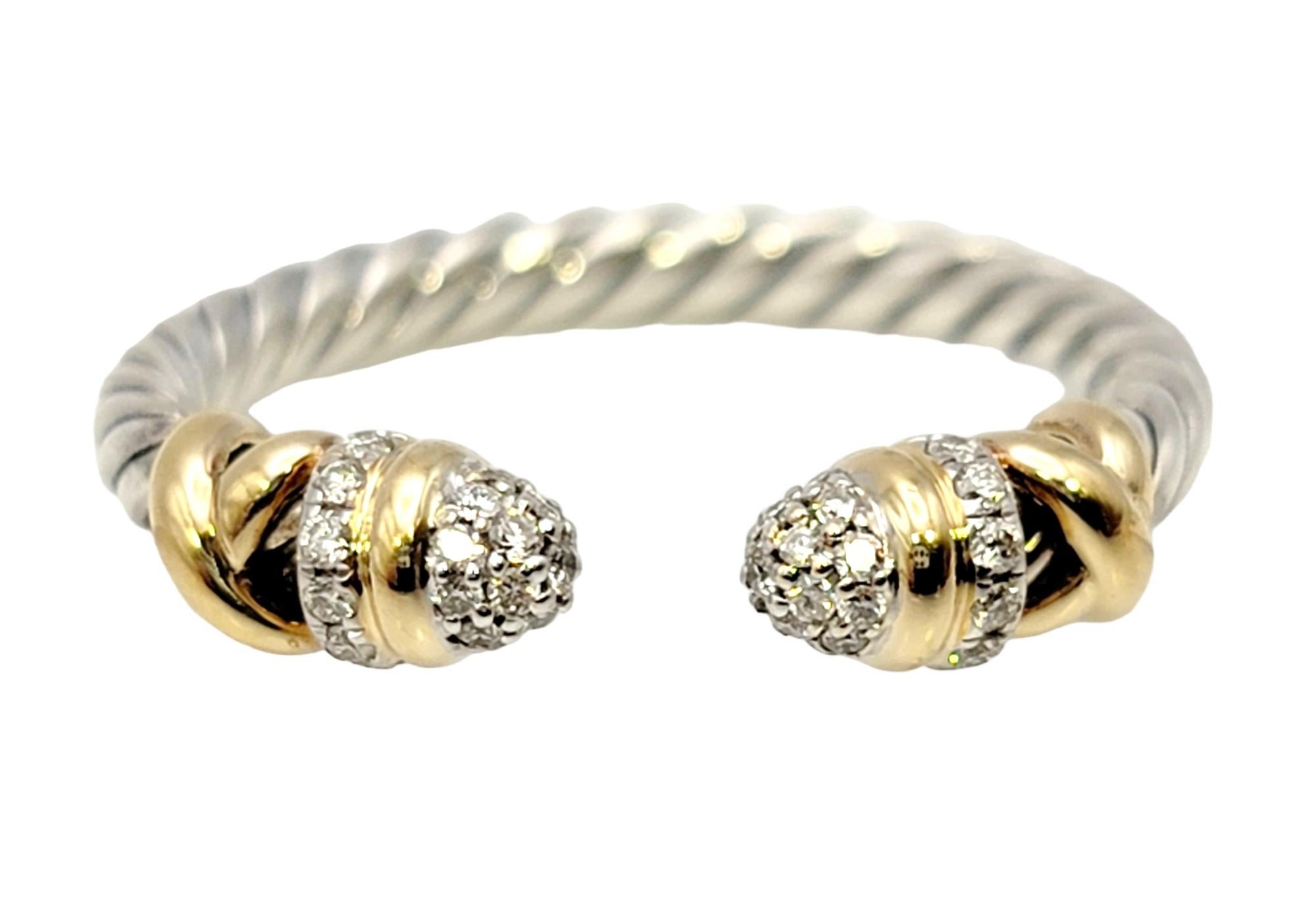 Ring size: 5.5

Dainty two-tone diamond cable ring by popular jewelry designer, David Yurman. Founded in 1980 by artists David and Sybil Yurman, the company is, in their own words, “one long art project.” Their ability to fuse fashion, art and