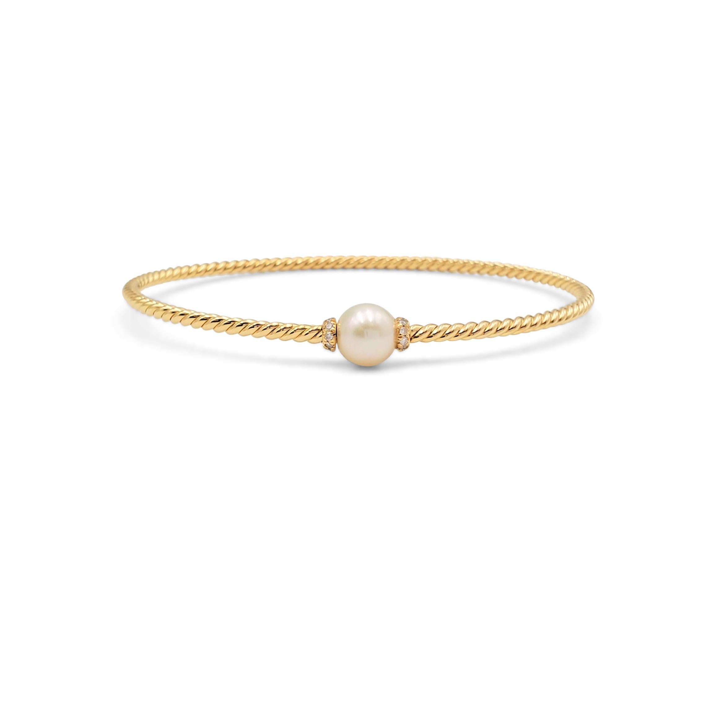 Authentic David Yurman 'Petite Solari' bracelet crafted in 18 karat yellow gold features a single cultured white Ayoka pearl and pave set diamonds weighing an estimated 0.08 carats total weight. The bracelet is completed with a secure magnetic