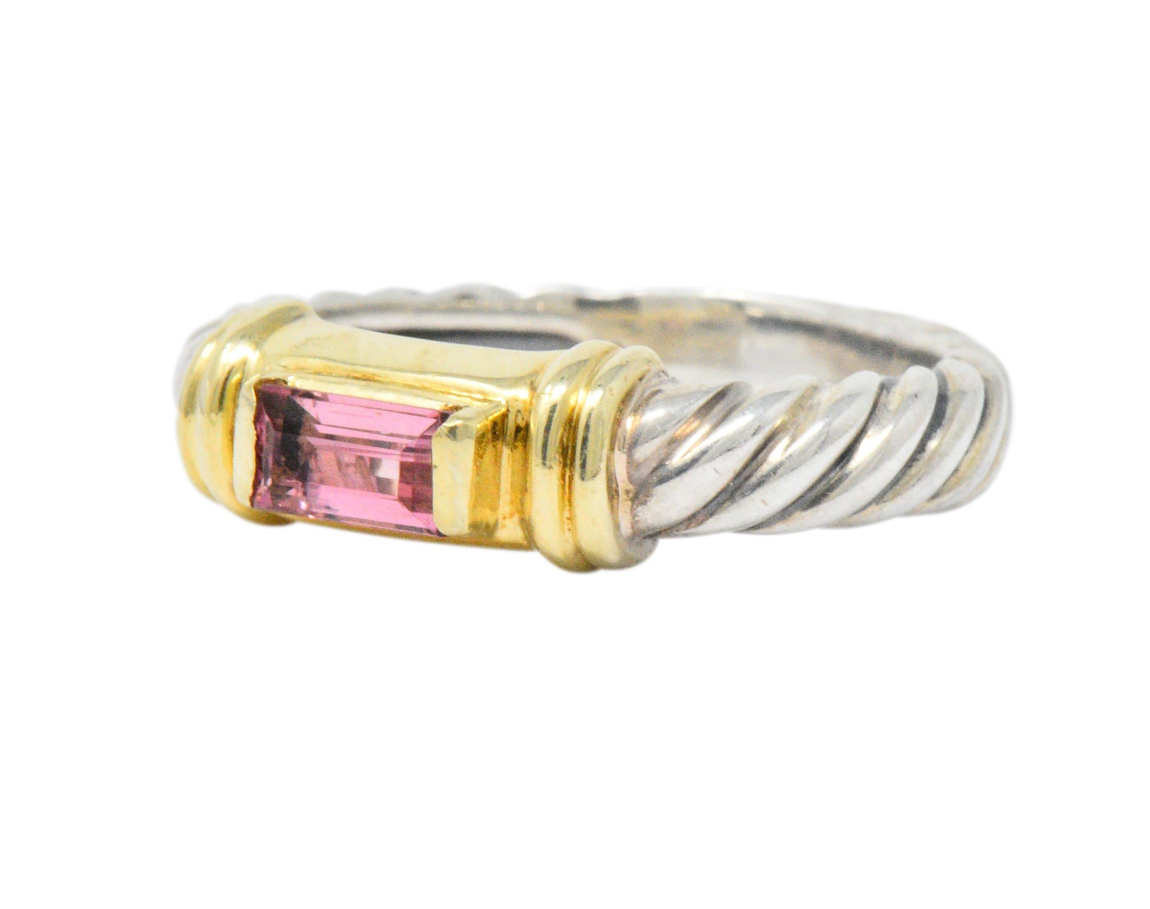 Centering an emerald cut pink tourmaline of deep pale rose

Elongated 14k yellow gold prongs on each end with ribbed accents

Classic David Yurman cable twist band

Signed DY 585 925 and from the Metro collection

Top measures 4.5 mm wide and sits 4