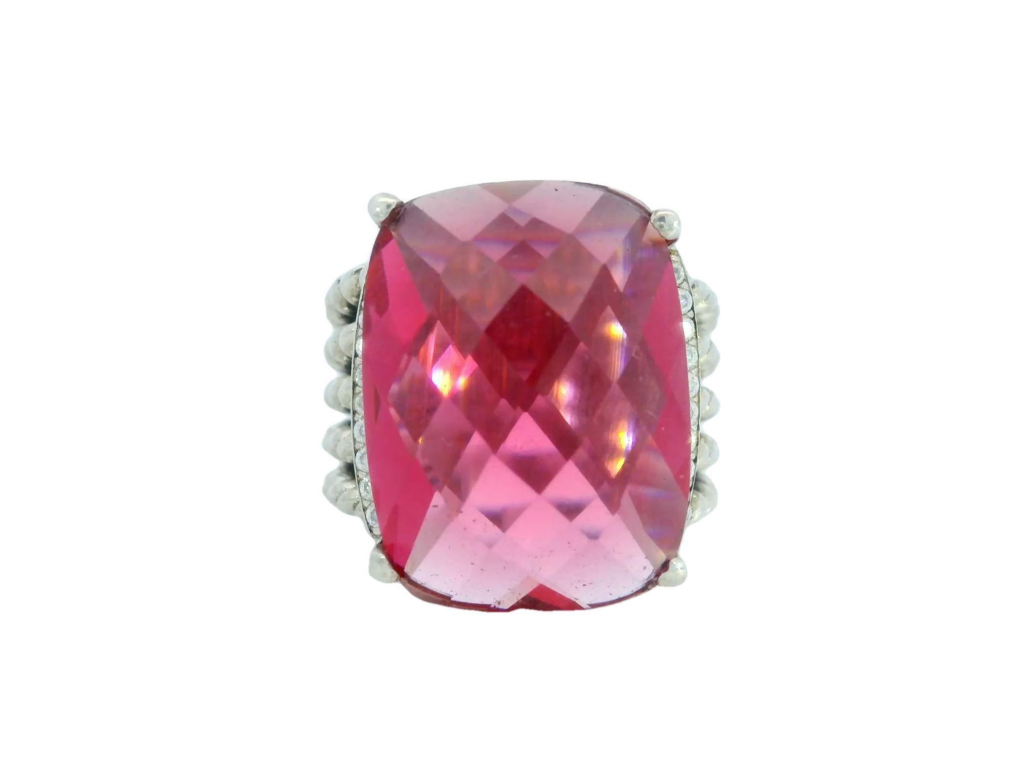 David Yurman Pink Tourmaline Ring Sterling Silver with Diamonds

This amazing ring by David Yurman is designed to catch your eye right away. At the center is a large, cushion-cut tourmaline that weighs an impressive 18.68 carats, and its bright pink