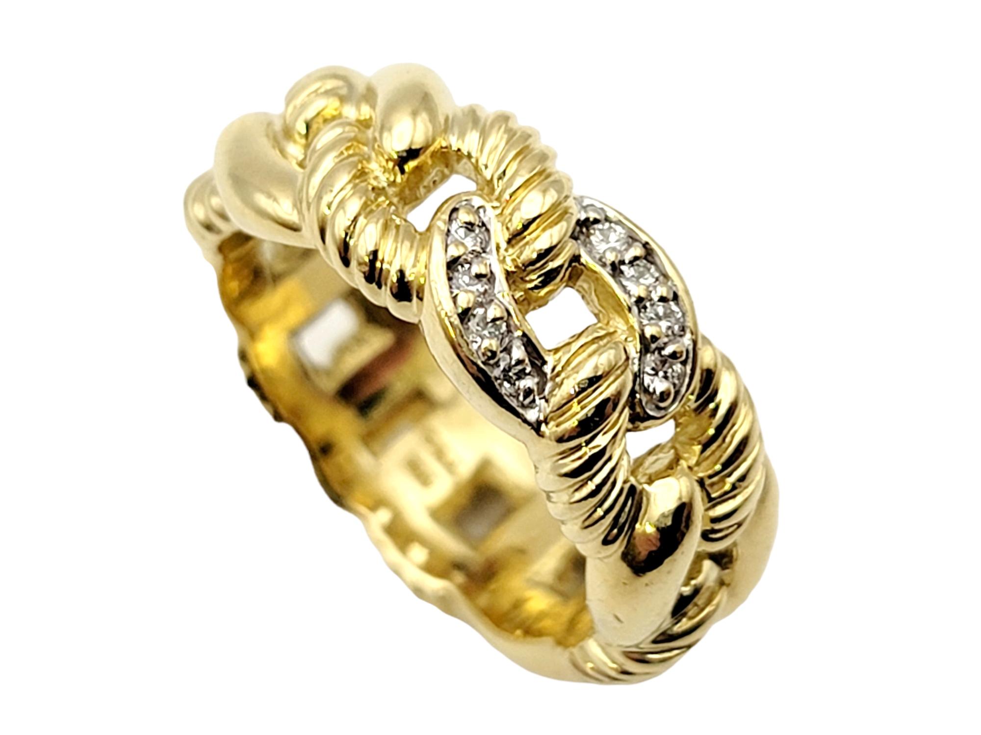 Ring size: 6

Elegant 18 karat yellow gold band ring by designer, David Yurman. Featuring interlocking chain links in an alternating pattern of solid and twisted gold, accented with a single sparkling diamond embellished link at the center.

Metal: