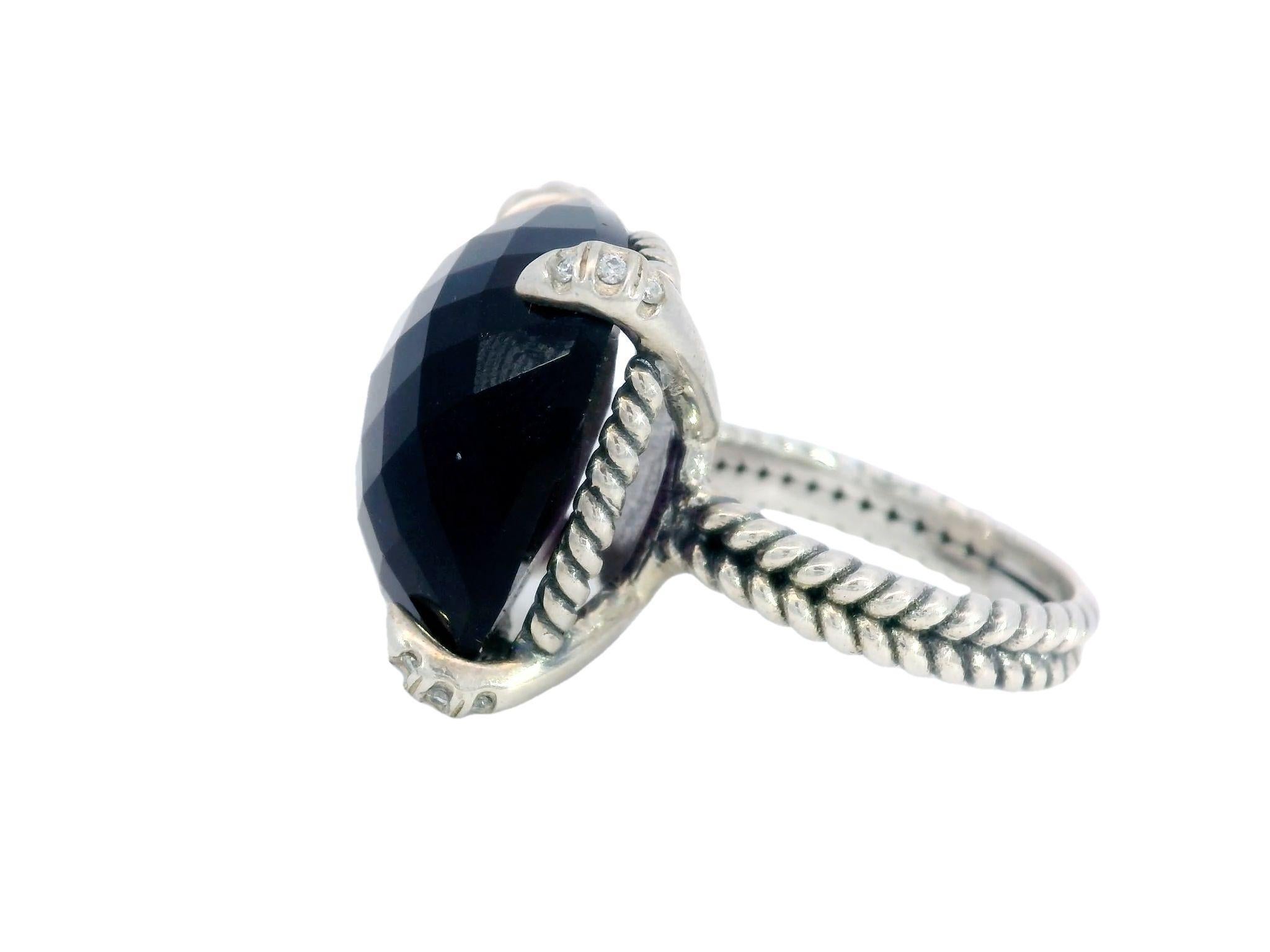 David Yurman Purple Amethyst Ring 14MM Sterling Silver with Diamonds

This modern David Yurman ring is a stunning piece that anyone would be proud to wear. Made from sterling silver, the ring features a large, cushion-cut amethyst weighing an