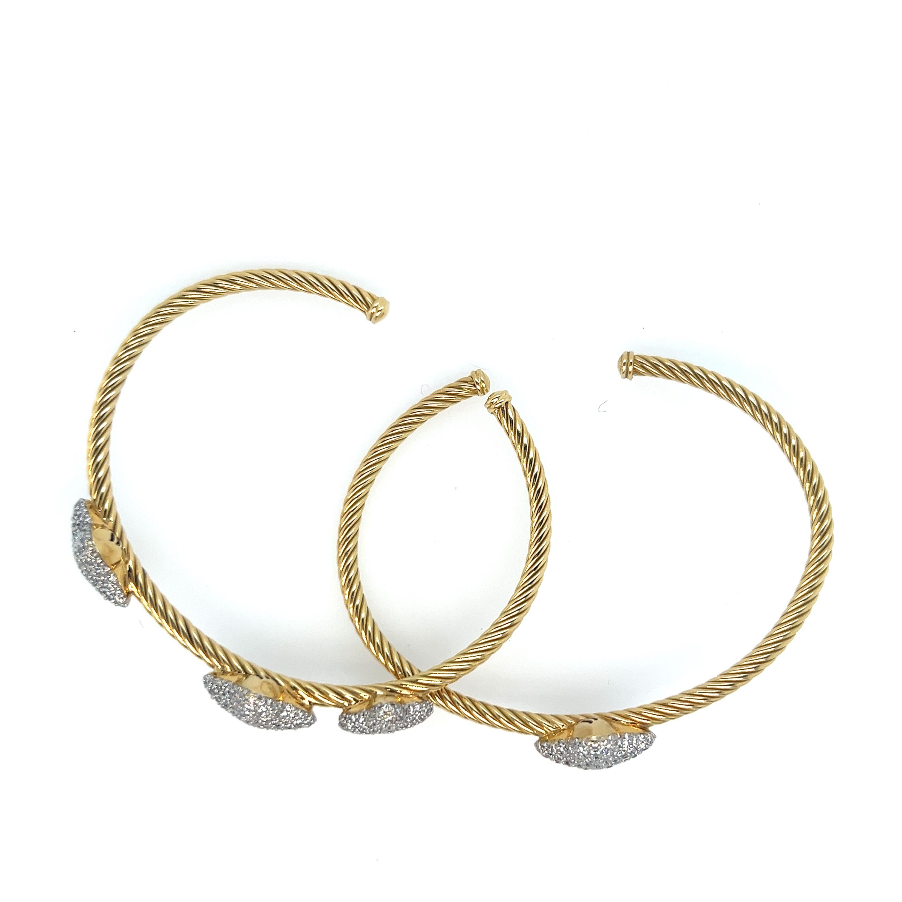 Gorgeous David Yurman 18kt two tone bangles.  This stunning pair of cuff bangles have pave round, brilliant diamonds that sparkle from every angle.  There are 2.5cts total weight.  The great thing is you can wear these together or single, or stacked