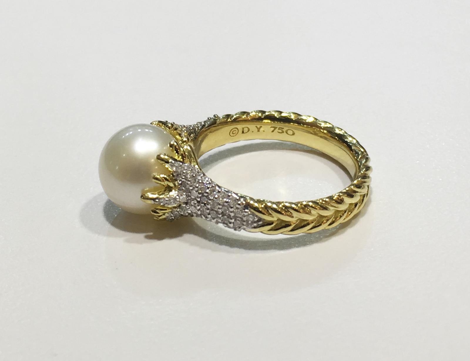 DAVID YURMAN RARE STARBURST PEARL 18K YELLOW GOLD & PAVE DIAMOND RING

-18k Yellow Gold
-Ring size: 7
-Pearl dimension: 9.5mm
-Diamond: 0.317ct

*Comes with David Yurman box.
Original Retail: $2,950