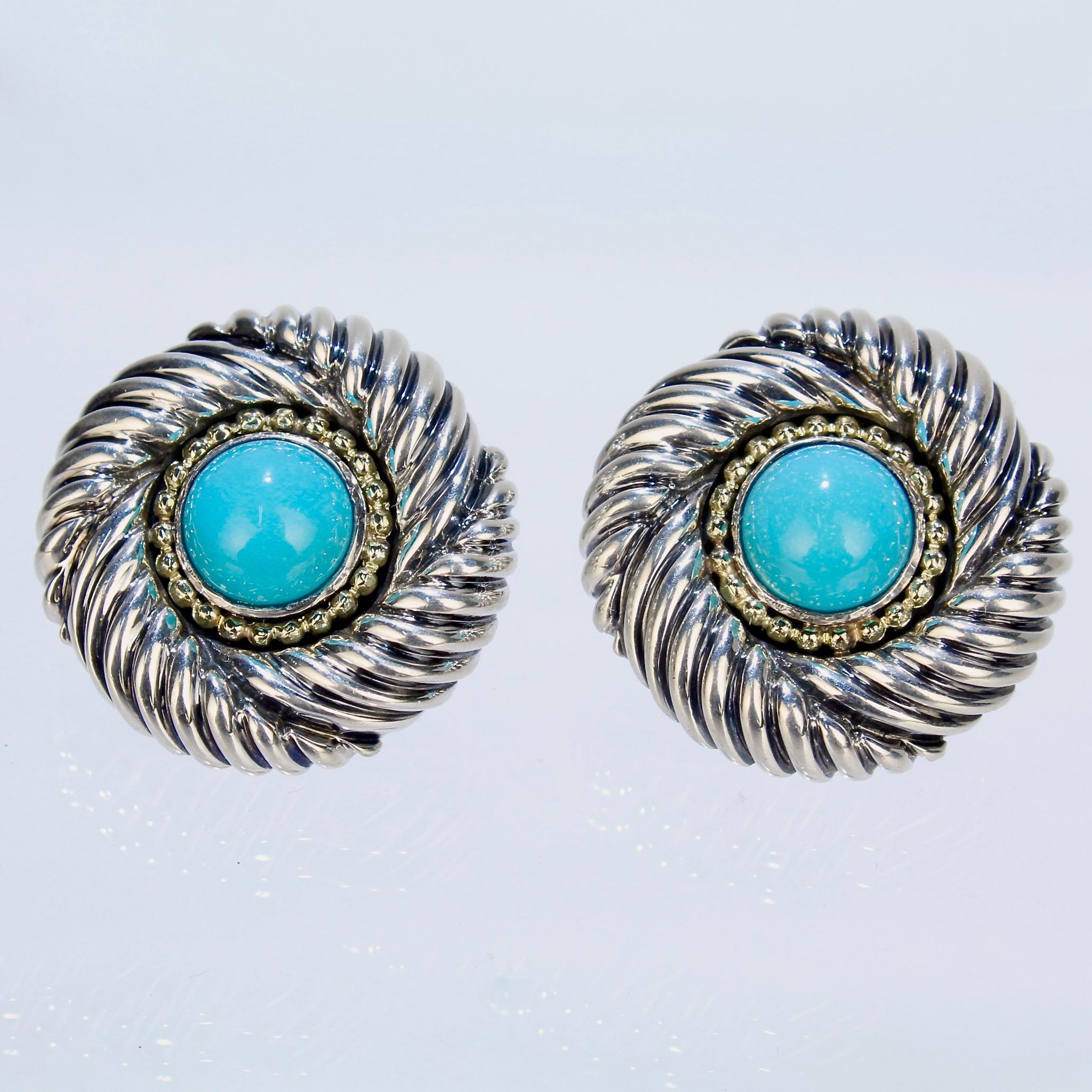 A wonderful pair of David Yurman Renaissance earrings.

Comprised of sterling silver, 14k gold, and turquoise. The turquoise cabochons are framed in a beaded gold wire and Yurman's classic Renaissance spiral design. 

Fashioned with Omega clips for