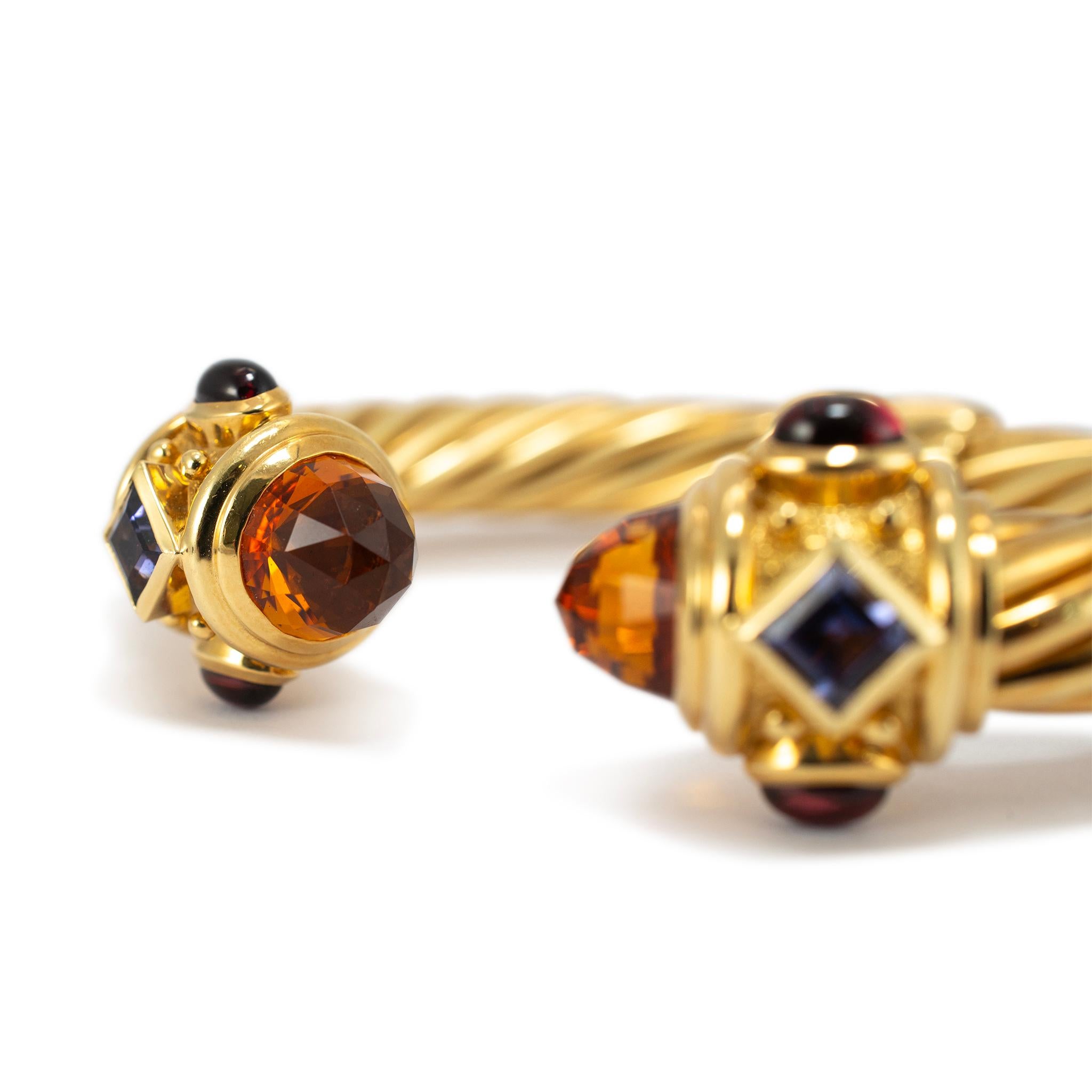 Brand: David Yurman

Gender: Ladies

Metal Type: 18K Yellow Gold

Length: 6.00 inches

Width: 10.00 mm

Weight: 57.67 grams

Ladies 18K yellow gold citrine sapphire pink tourmaline and iolite cuff bracelet. The metal was tested and determined to be
