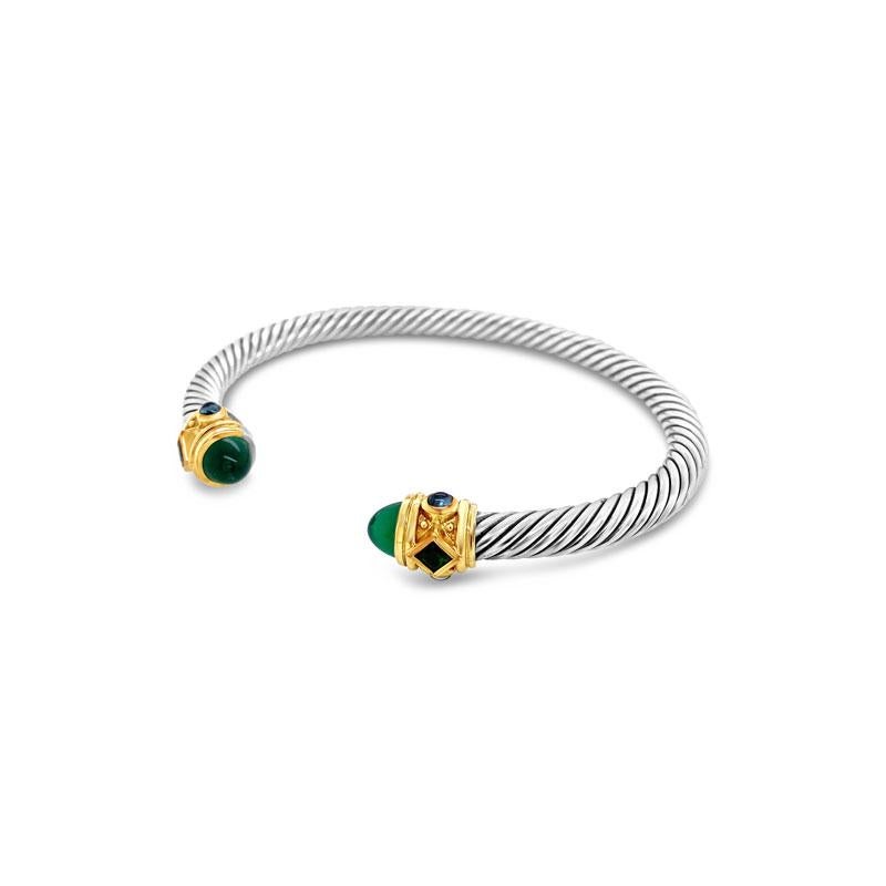 A classic David Yurman cable bracelet from the Renaissance collection, this bracelet is crafted from sterling silver.  It features faceted Green Onyx  with Cabochon Chrome Diopside and Hampton Blue Topaz set in 14 karat yellow gold.  This bracelet