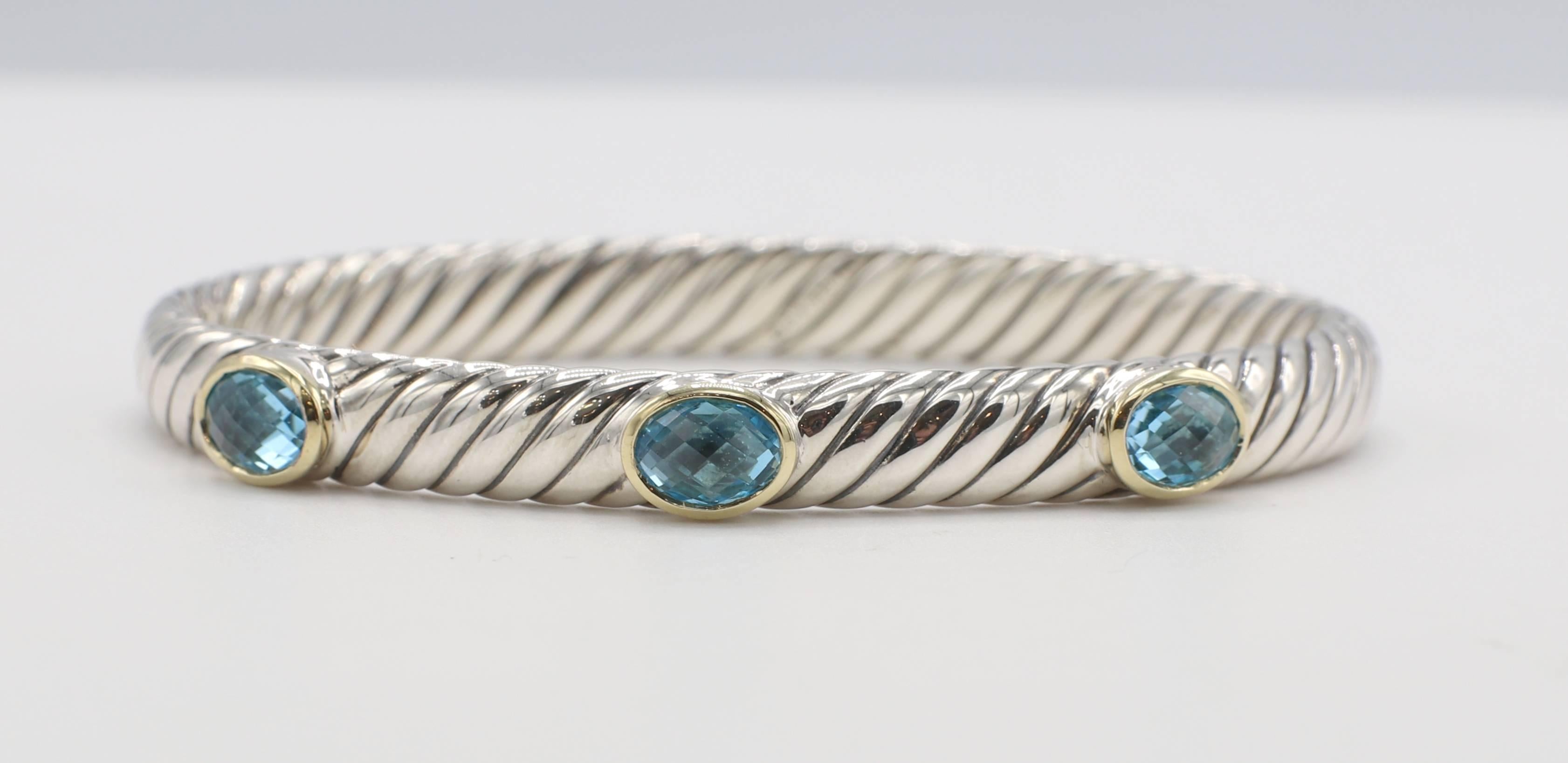 David Yurman Renaissance Sterling Silver Blue Topaz Three Stone Hinged Bangle Bracelet 
Metal: Sterling silver & 18k yellow gold
Weight: 29.29 grams
Width: 6.5mm
Diameter: 60mm
Length: Approx. 6.5 inches 
