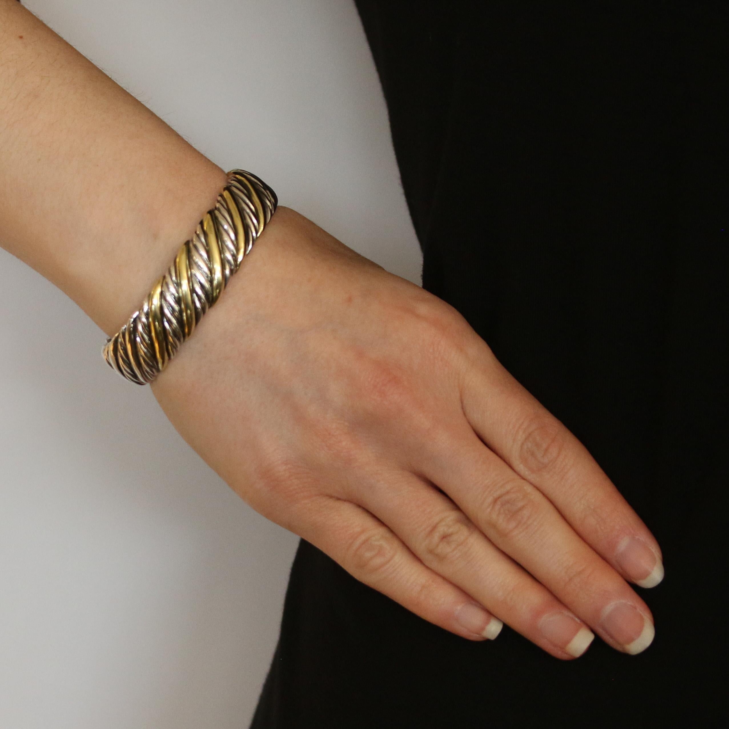 Brand: David Yurman
 Collection: Cable 
 
 Metal Content: Sterling Silver & 18k Yellow Gold
 
 Bracelet Style: Cuff
 Closure Type: N/A (slides over wrist)
 
 Measurements: 
 Inner circumference: 6 1/4