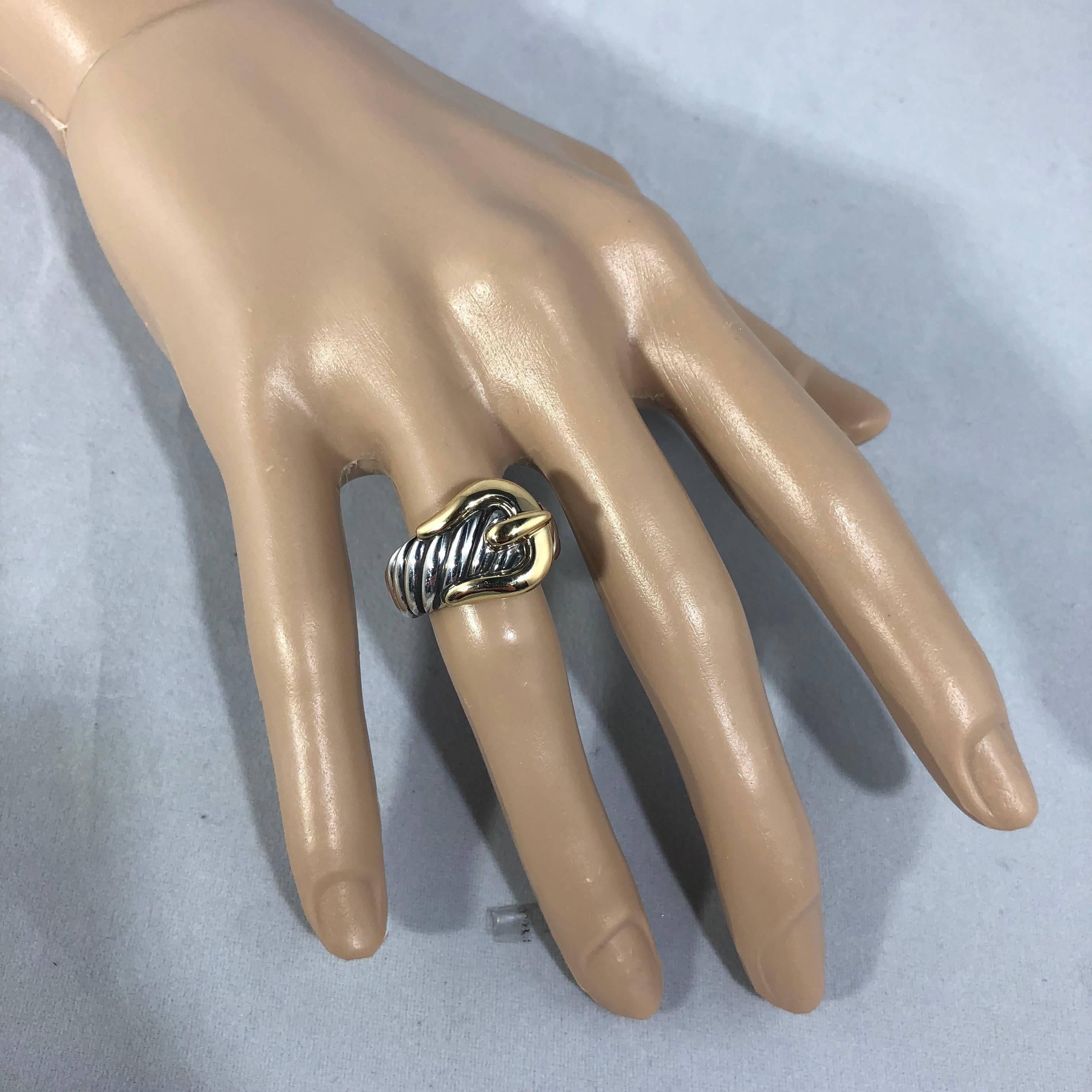 David Yurman signature cable collection buckle ring. Created in Sterling Silver and 18 Karat yellow Gold, this cable motif ring is classic and collectible. Size 6 . Metal weight ,11.2 grams / 7.2 dwt . Retail $750.00. 