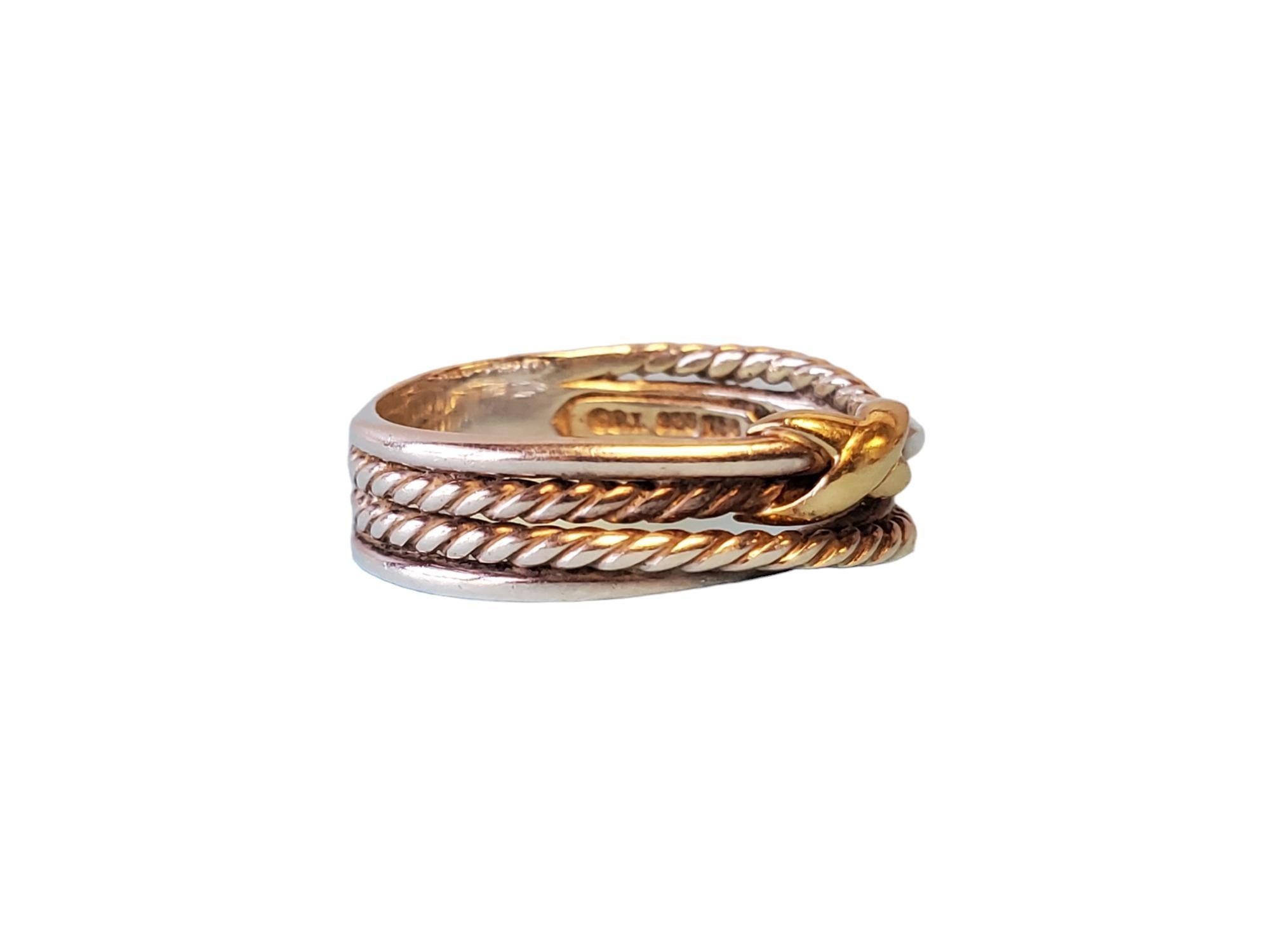 David Yurman signed Bypass Ring

Listed is this fantastic David Yurman sterling silver and 18k yellow gold designer bypass ring. The band wears beautifully and features a twisted bypass design with 18k yellow gold bow accent. This wonderful ring