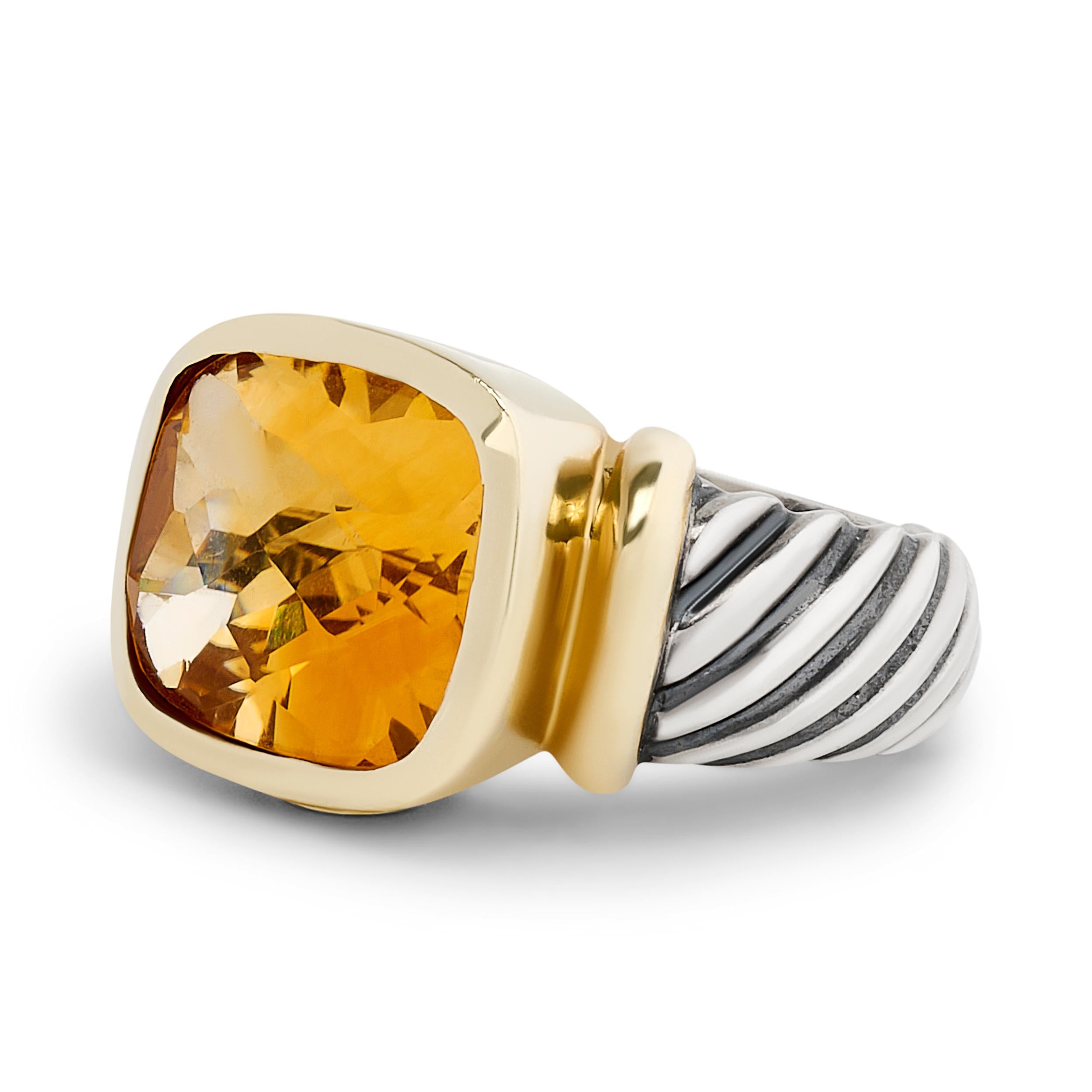 A touch of autumn elegance, this David Yurman Noblesse ring features a stunning citrine gemstone set in a striking silver and 14K yellow gold design, radiating warmth and sophistication.
The cushion cut citrine weighs approximately 7.60
