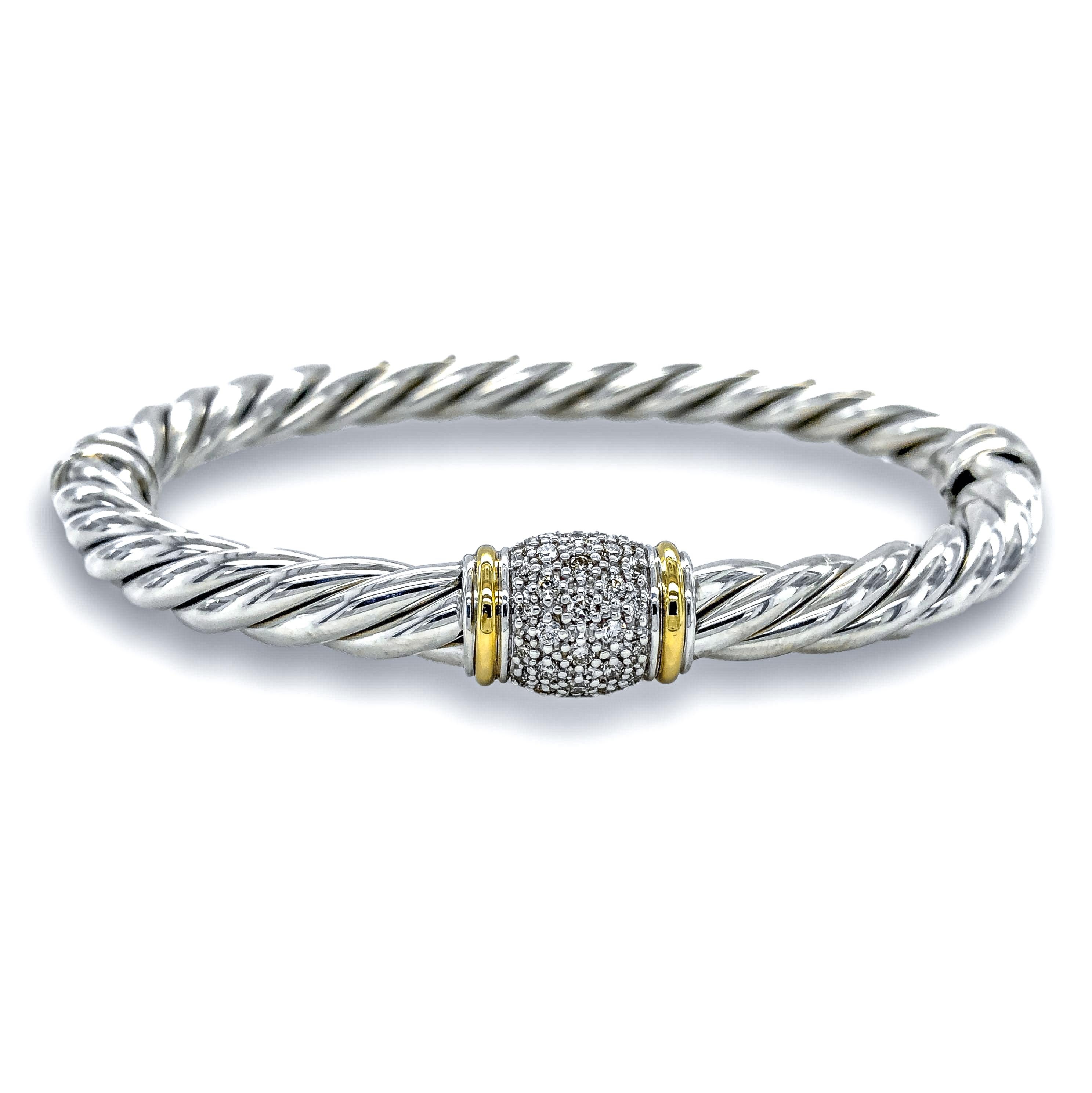Vintage David Yurman Narrow two tone bangle bracelet from the cable classics collection finely crafted in sterling silver featuring a station of pave set round brilliant cut diamonds weighing 0.22 cts total weight approximately inside 2 strip