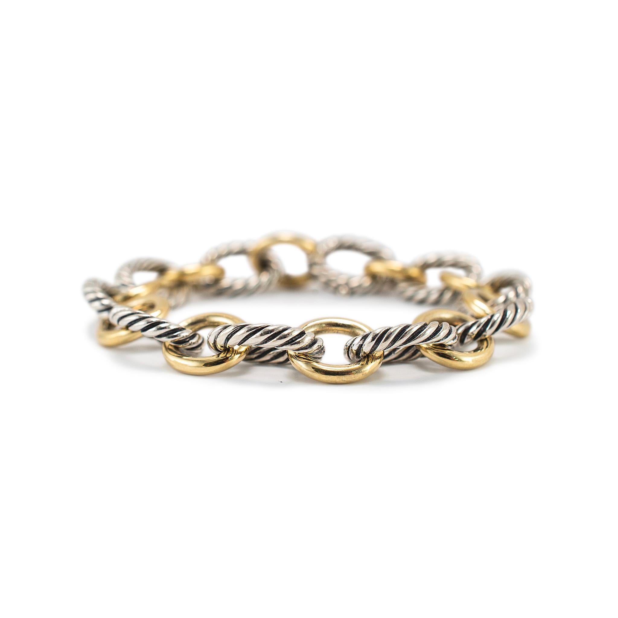Brand: David Yurman

Gender: Ladies

Metal Type: 14K Yellow Gold & Silver

Length: 7.00 inches

Width: 12.50 mm

Weight: 35.49 grams

One DAVID YURMAN polished, 18K yellow gold and silver, link bracelet. Engraved with 