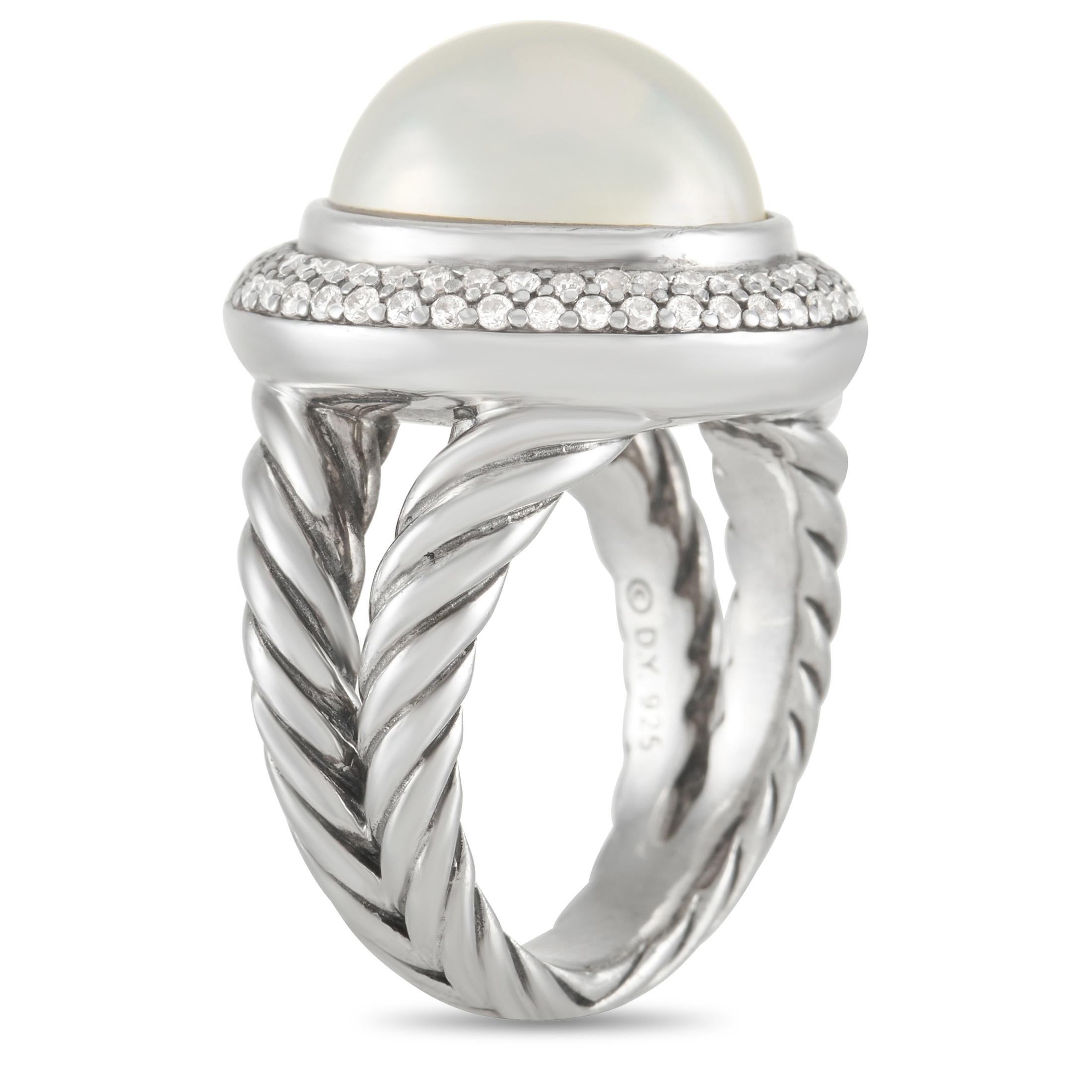 This estate ring from David Yurman is equal parts intricate and effortless. It begins with the opulent silver setting, which features a beautifully twisted band measuring 7mm wide. A large Mobee Pearl surrounded by an array of inset diamonds gives