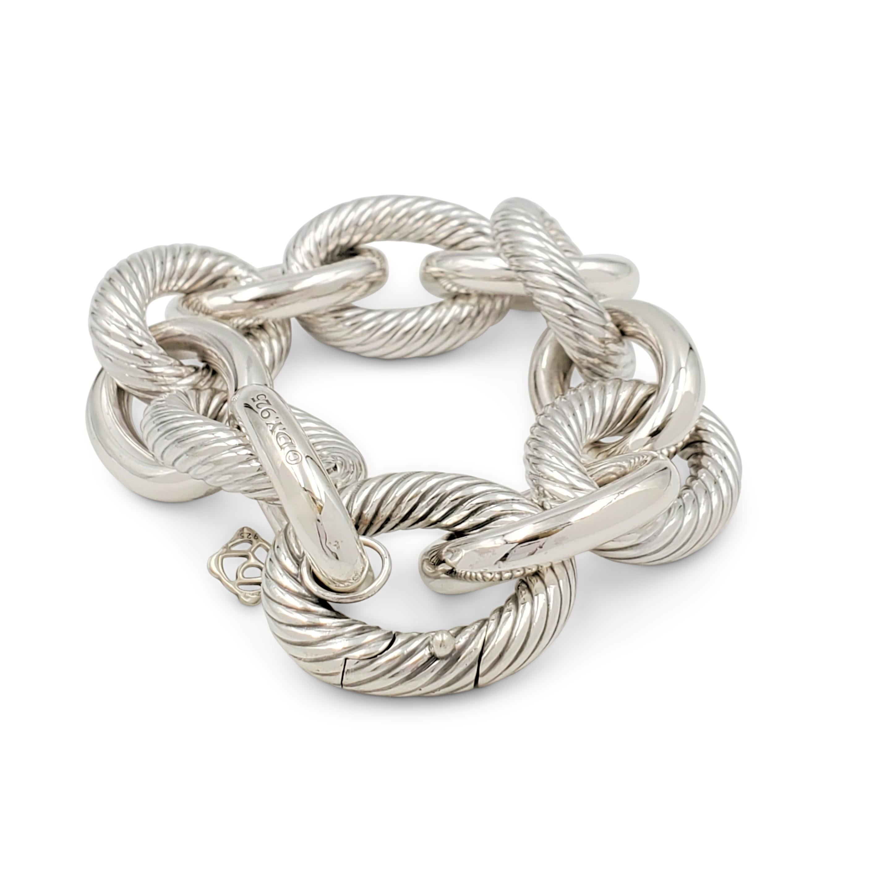 Authentic David Yurman bracelet crafted in sterling silver features alternating high-polish and cable textured extra-large oval links. Signed DY, 925. The bracelet measures 8 1/2 inches in length and features a push clasp. Not presented with the