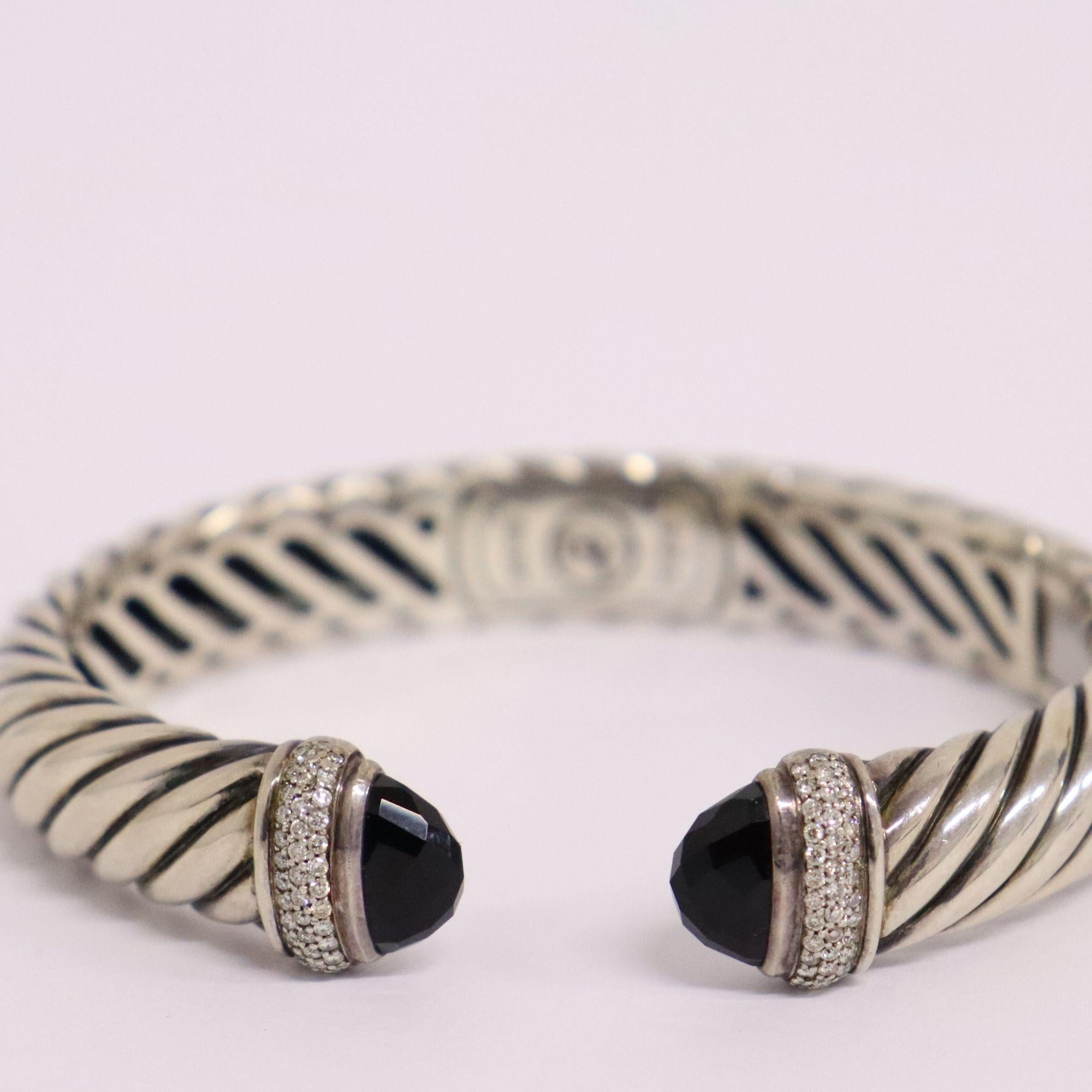 David Yurman sterling silver waverly open cuff bracelet with onyx and approximately 0.36ctw of Diamonds.

Condition: very minimal signs of wear
Approx Diameter: 18cm
Width: 1cm
