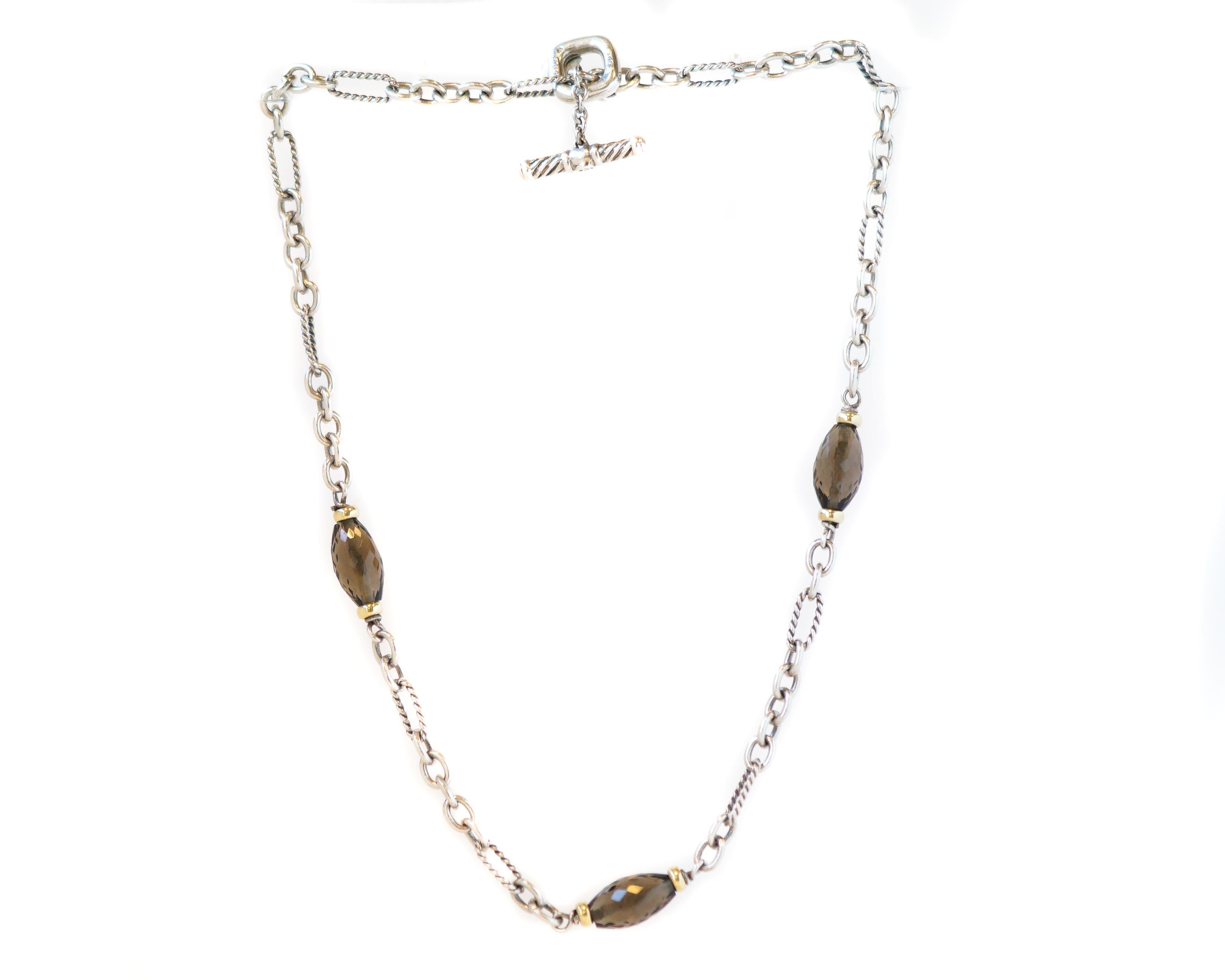 1980s David Yurman Link Necklace - Sterling Silver, 18 Karat Yellow Gold, Smoky Quartz

Features:
17 inches long
Sterling Silver Smooth and Textured Cable Links
3 Faceted Smoky Quartz Beads with 18 Karat Yellow Gold end cap beads
Toggle