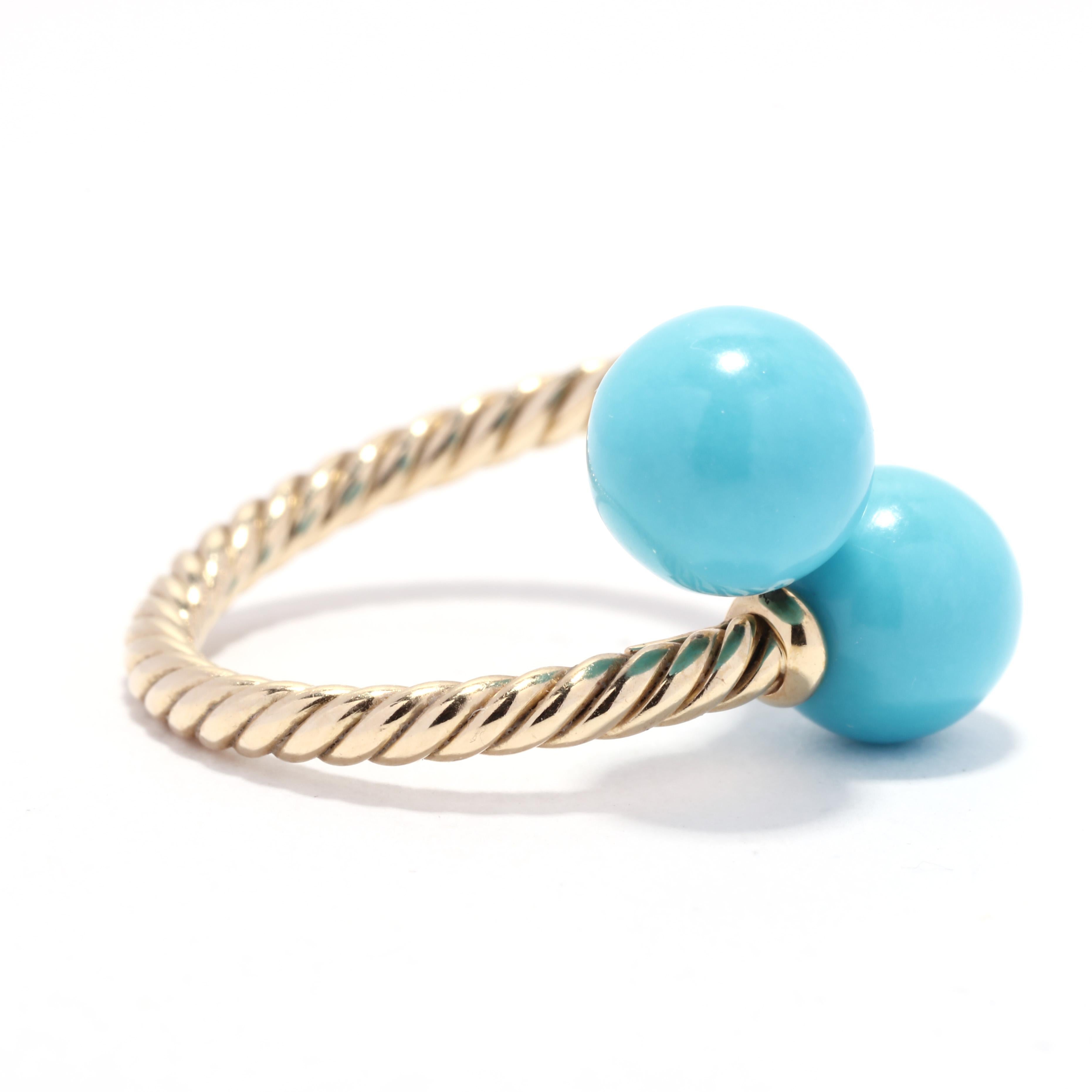A David Yurman Solari 18 karat yellow gold turquoise bypass ring. This blue turquoise cocktail ring features a bypass design with a cable motif band and two turquoise beads at each end.

Stones:
- turquoise, 2 stones
- round bead
- 8.5 mm

Ring Size