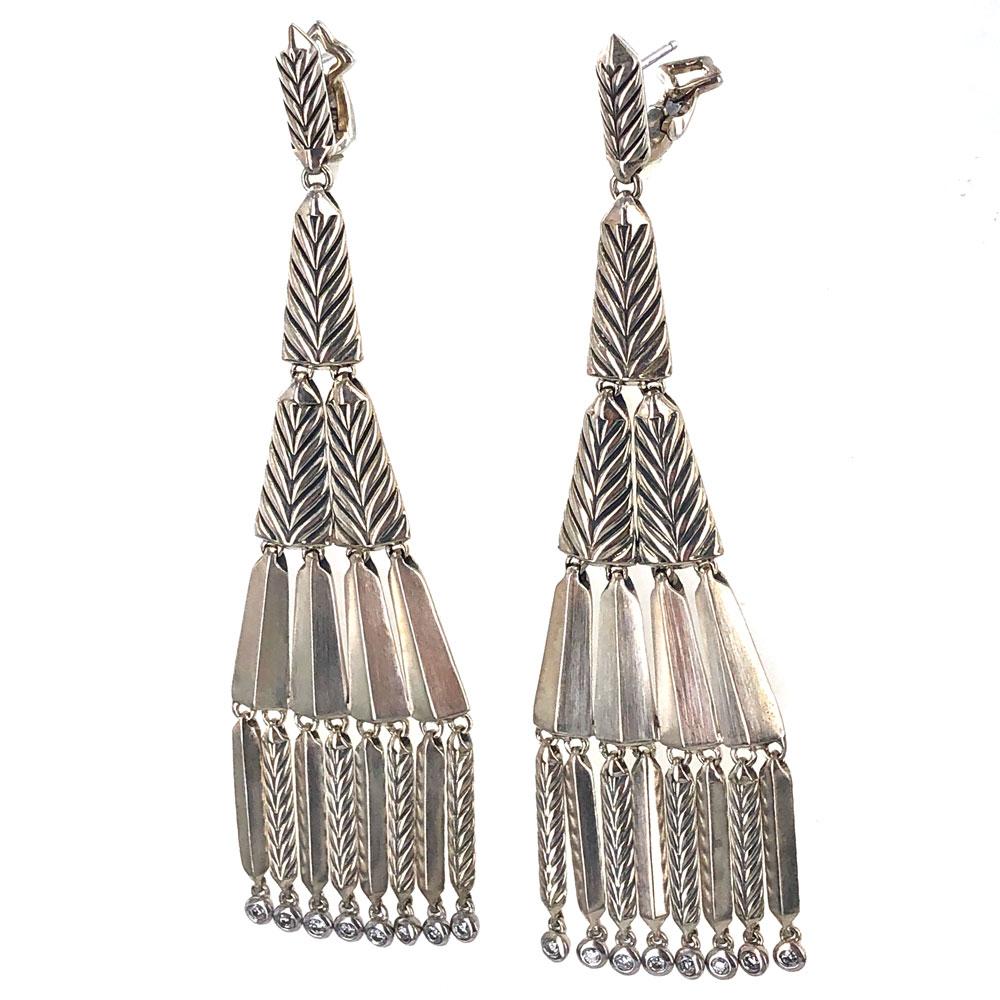 These Modern David Yurman Special Edition Chandelier Diamond Earrings are fashioned in sterling silver. The 16 round brilliant cut diamond drops equal approximately .50 carat total weight. The earrings measures 3.5 inches in length and are signed DY