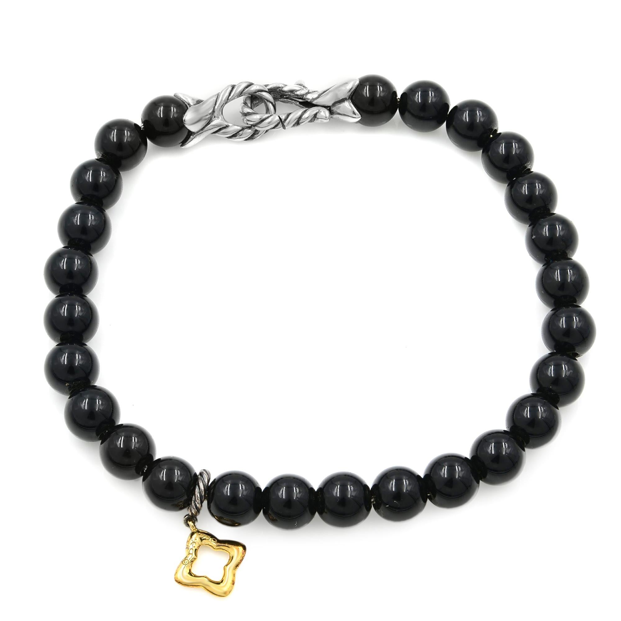 New Condition!
6mm Black Onyx Bracelet 7.5 inches with Gold Quatrefoil Charm
Sterling silver lobster claw lock marked with 