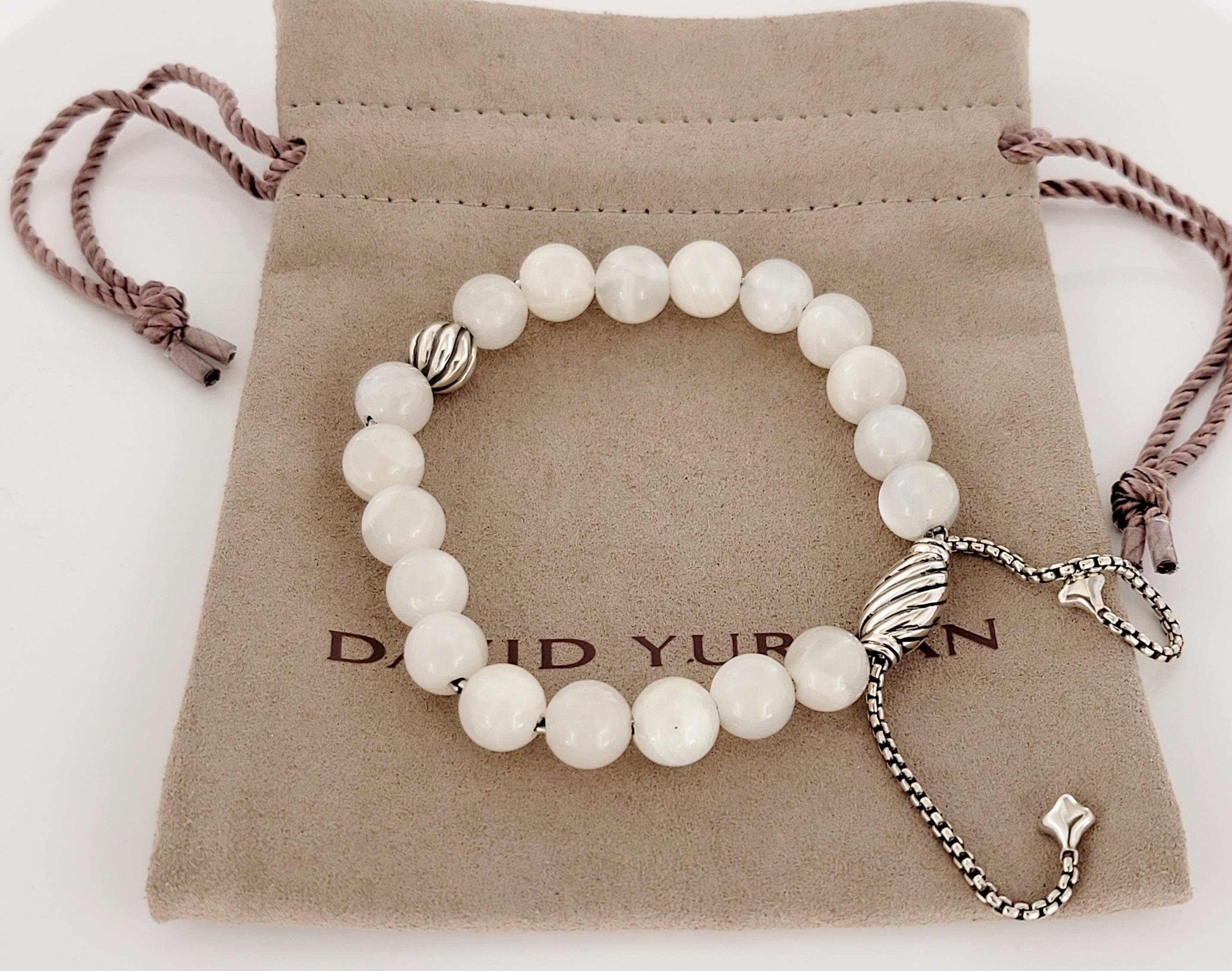David Yurman
White bead bracelet 
Onyx width 8mm
Adjustable length 
Material Sterling Silver925
Comes with David Yurman pouch
Retail Price:$450
Condition New, without tags