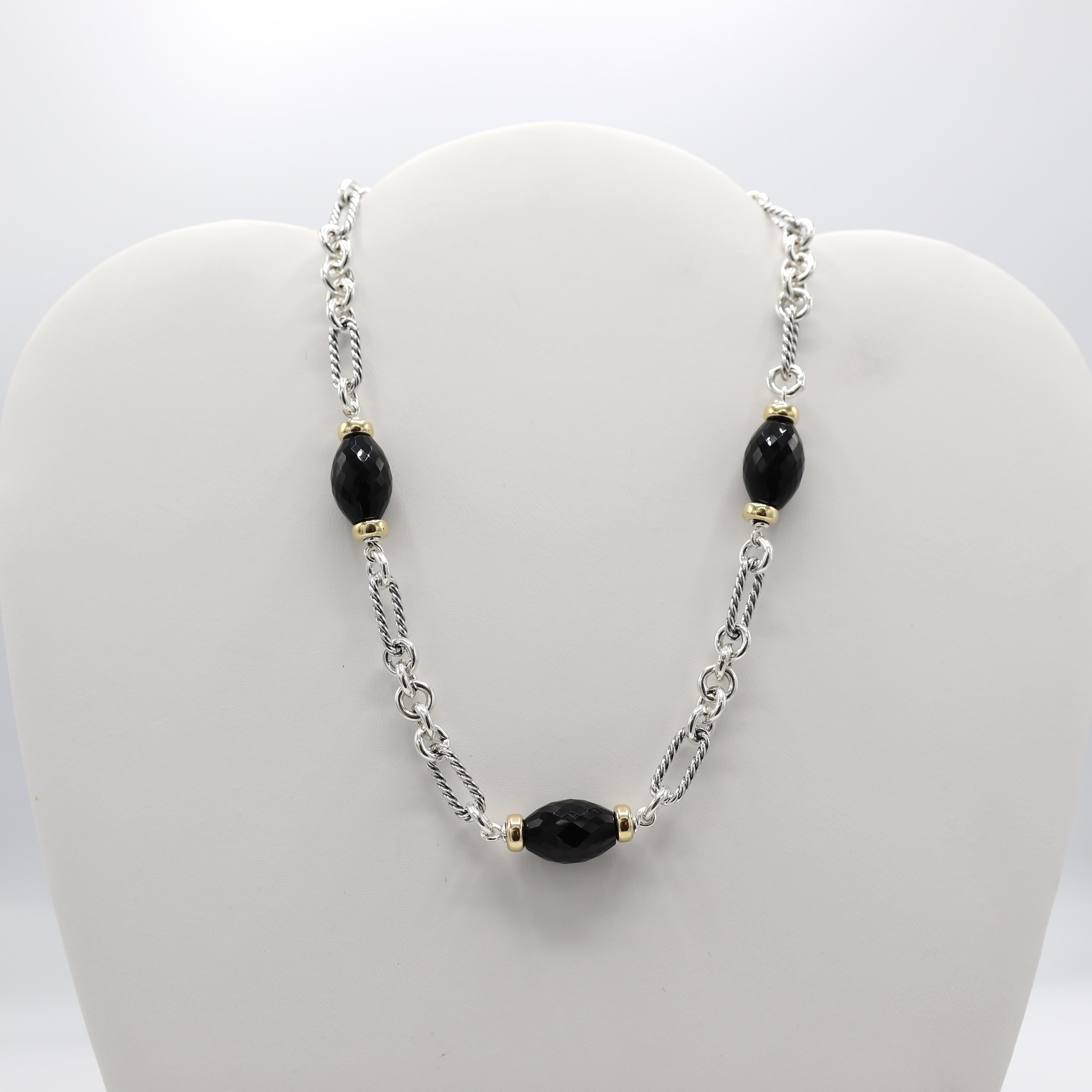 David Yurman Sterling & Gold Onyx Station Chain Link Necklace 
Metal: Sterling silver & 18k yellow gold
Weight: 40.4 grams
Length: 15 inches
Onxy: 16 x 11mm
Clasp: Toggle
