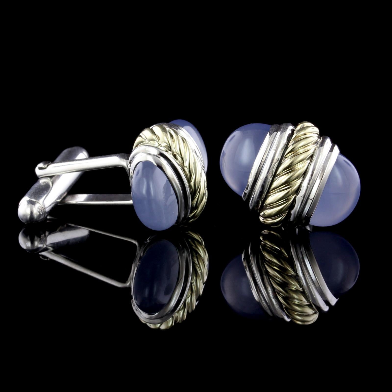 David Yurman Sterling Silver and 14K Yellow Gold Blue Chalcedony Bullet
Cufflinks. The tops measure 18.00 x 14.50mm.