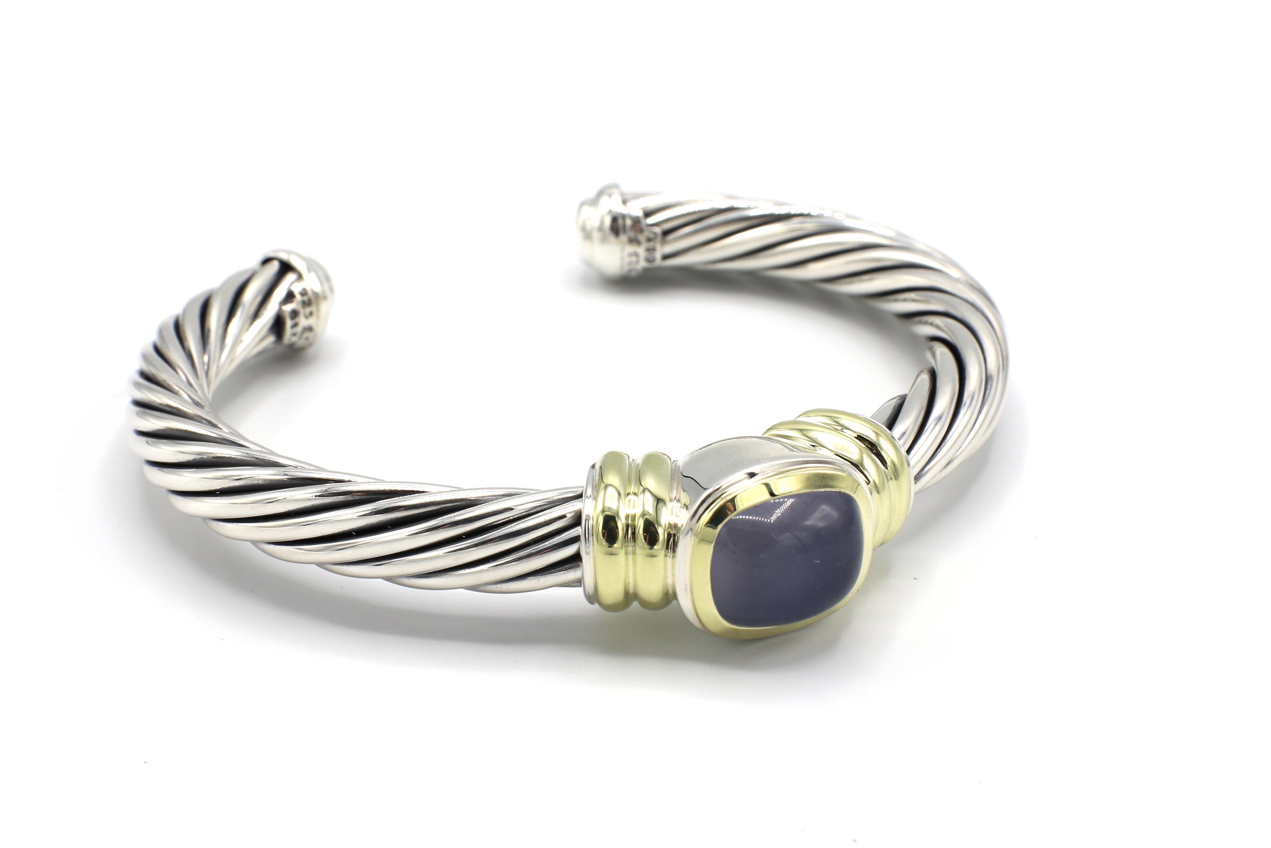 David Yurman Sterling Silver & 14 Karat Gold Chalcedony Cable Cuff Bracelet 
Metal: Sterling silver, 925 & 14k yellow gold 585
Weight: 45.95 grams
Width: 7 - 13.3 MM
Length: Approx. 6.75 inches
Signed: D.Y. 925 585
