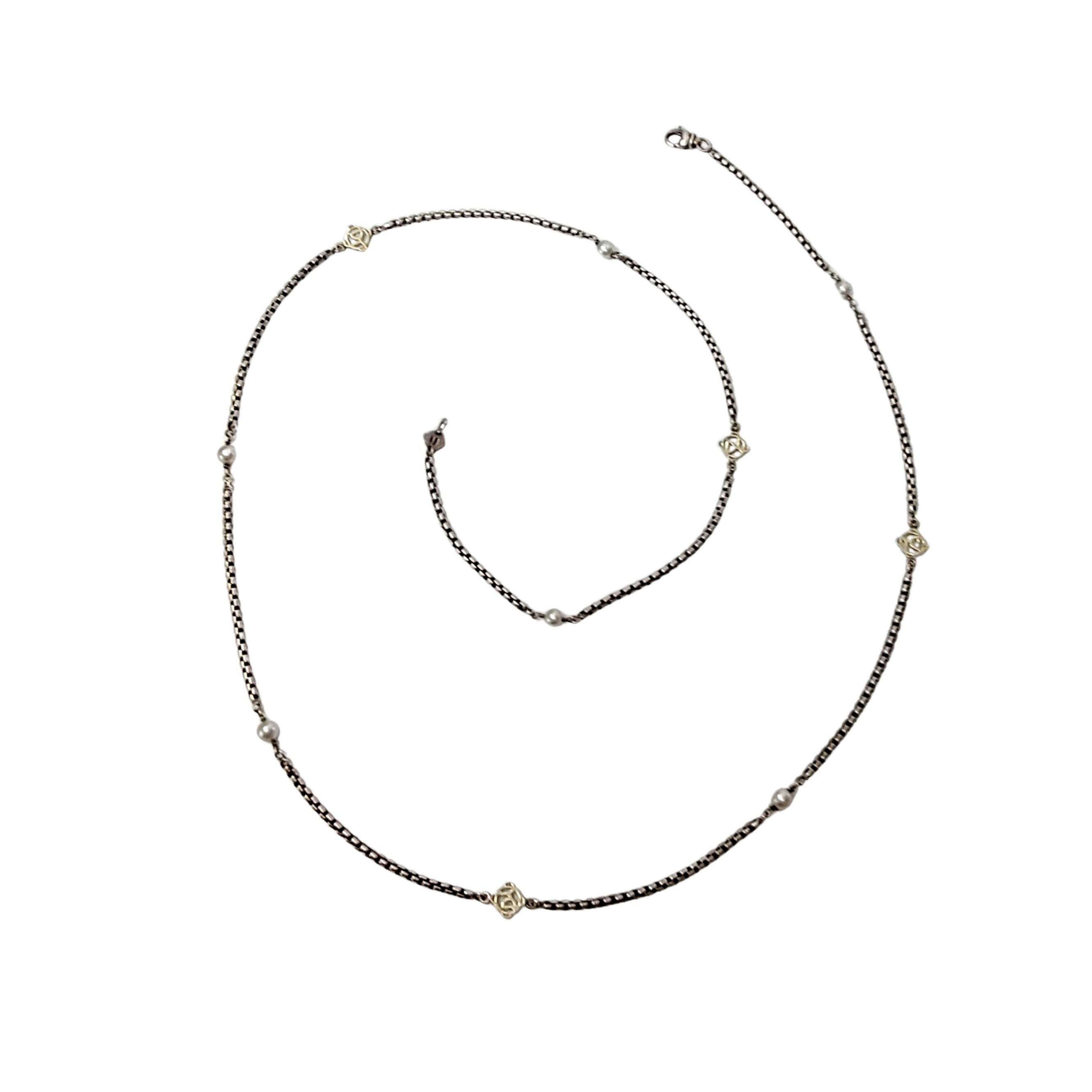 Sterling silver and 14K gold DY logo and pearl necklace by David Yurman.

Sterling silver box chain necklace with 14K yellow gold DY logos and cultured pearls. Lobster clasp closure.

Measures approx 31