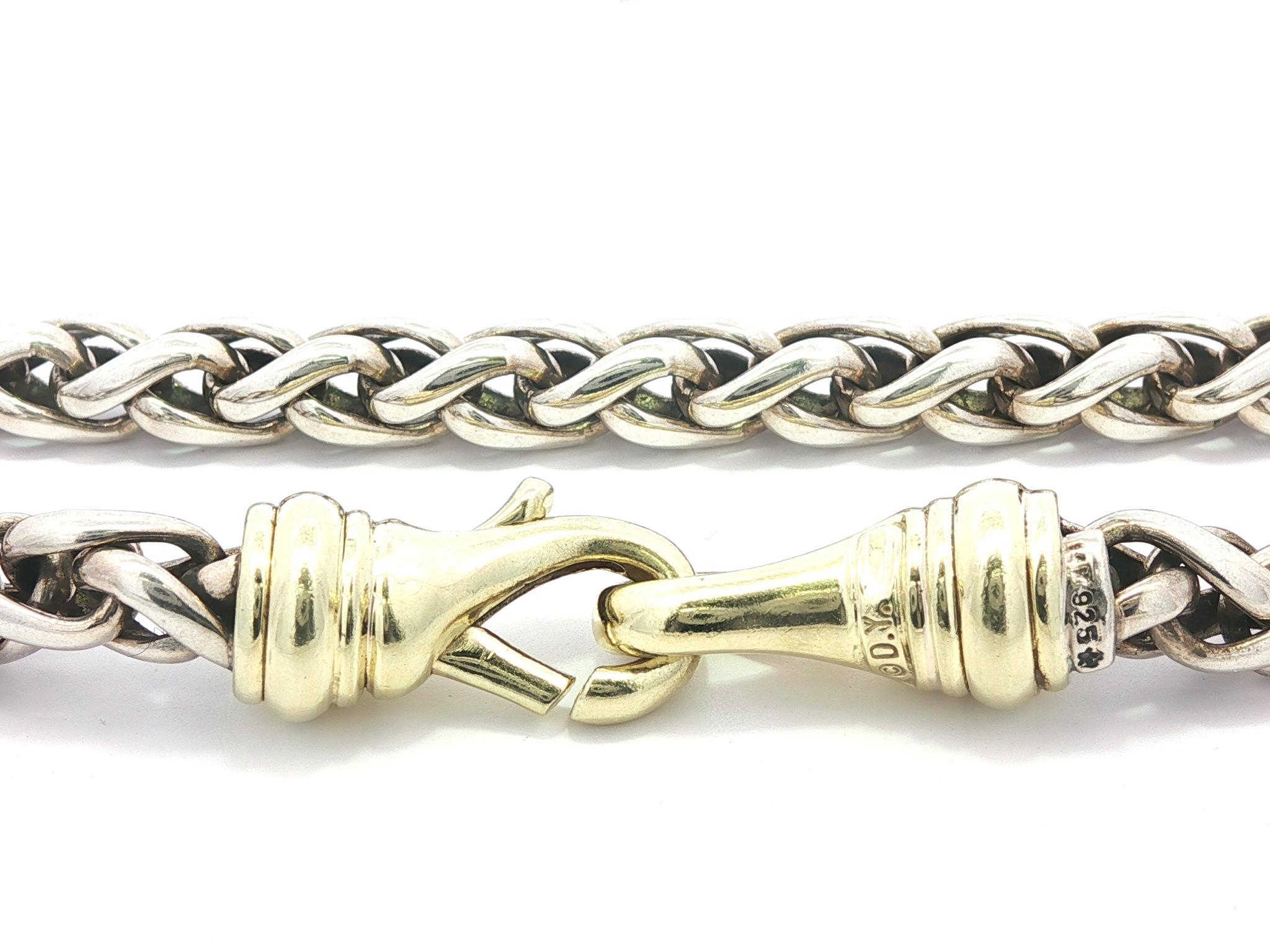 Material: Solid Sterling Silver w/ 14k Yellow Gold Clasp
Weight: 54.89 Grams
Chain Type: Wheat link
Chain Length: 16 inches
Chain Width: 5.7mm (0.22