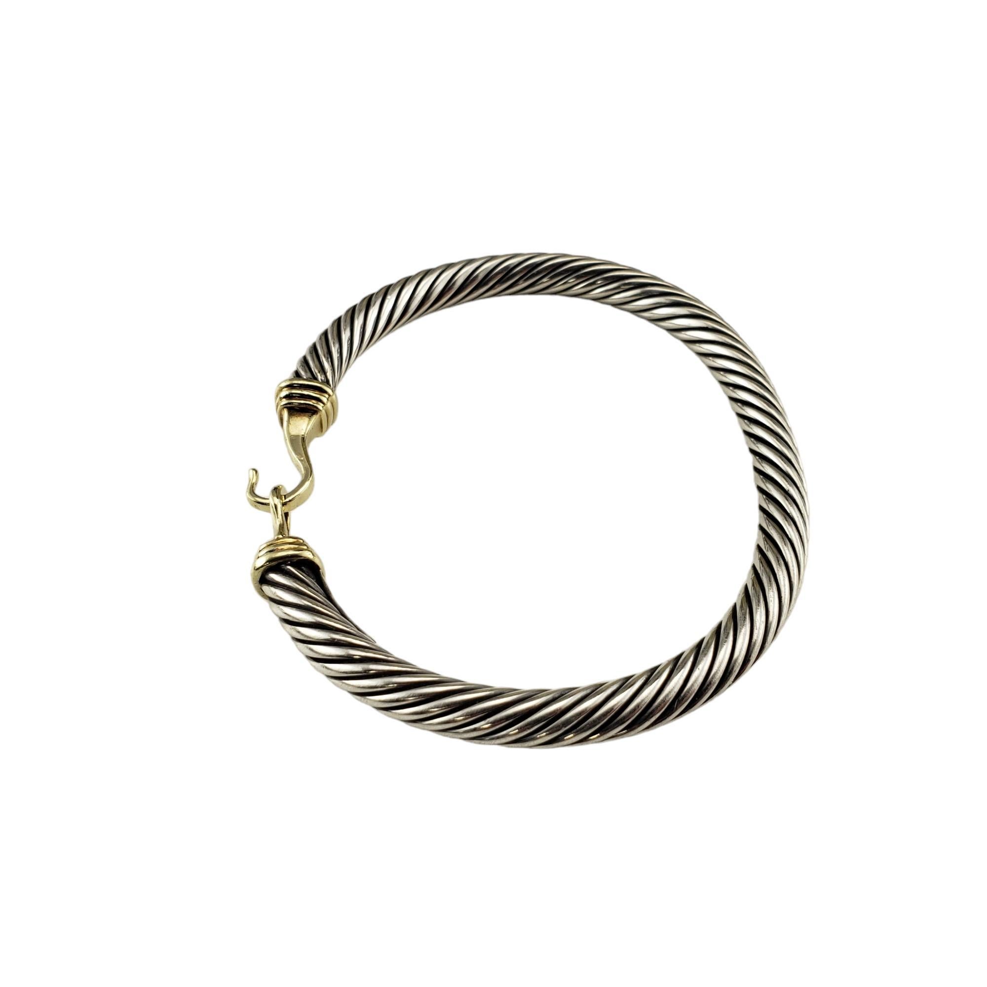 David Yurman Sterling Silver and 14K Yellow Gold Cable Buckle Bracelet

This elegant cable buckle bracelet by David Yurman is crafted in beautifully detailed sterling silver and 14K yellow gold.  

Width: 5 mm.

Size: 6.5 inches

Hallmark:  Yurman