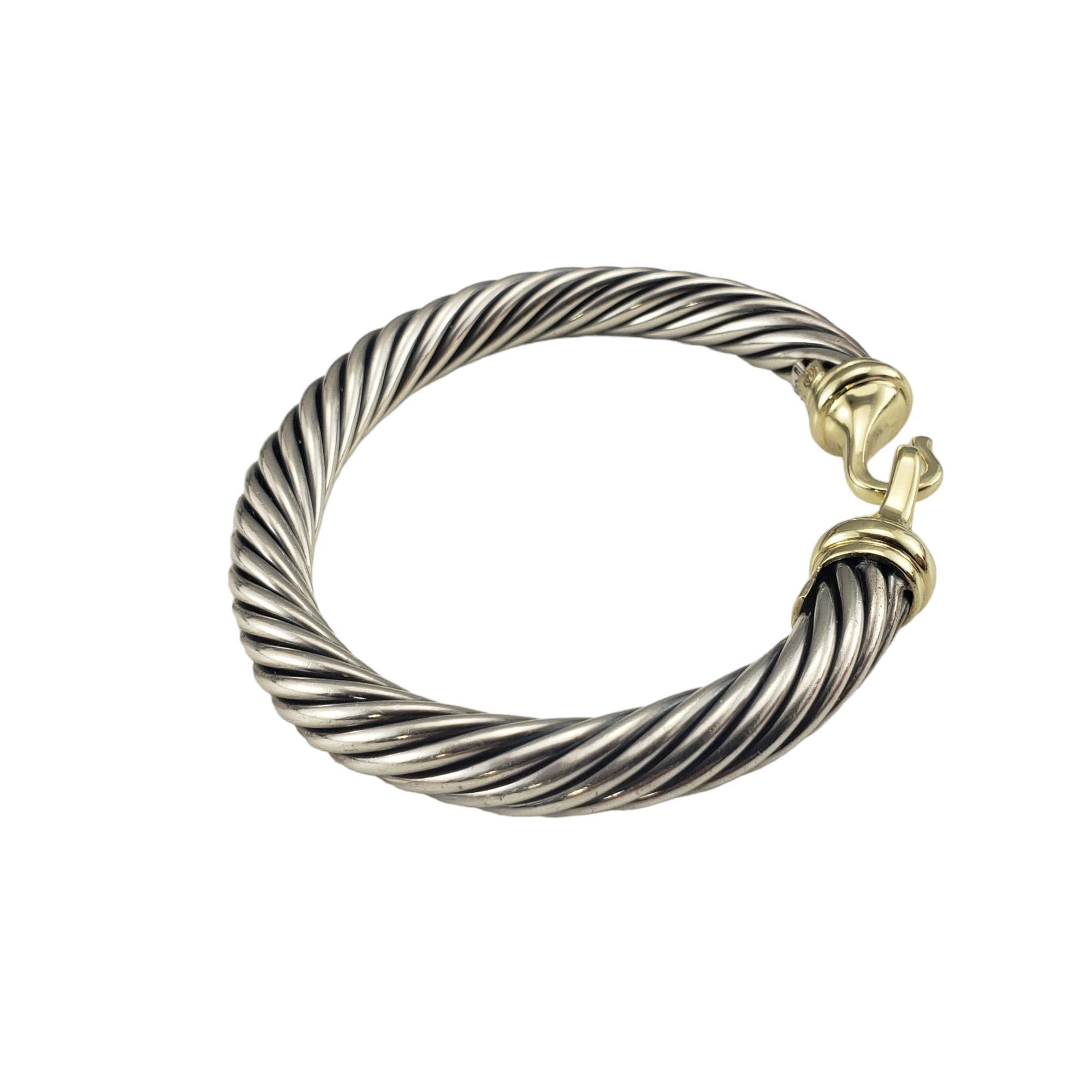 David Yurman Sterling Silver and 14K Yellow Gold Cable Buckle Bracelet-

This stunning David Yurman cable bracelet is crafted in beautifully detailed sterling silver and 14K yellow gold.  Buckle closure. 

Width: 7 mm.

Size: 6 inches

Hallmark: DY 