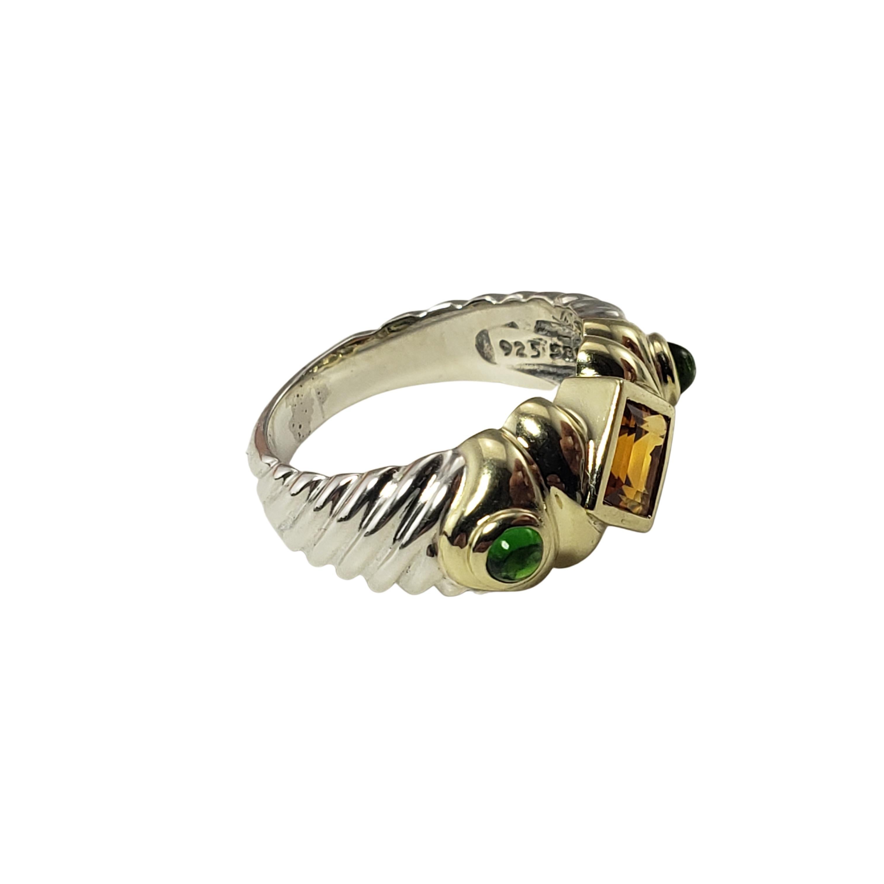David Yurman Sterling Silver and 14 Karat Yellow Gold Citrine and Emerald Ring Size 5-

This lovely ring by David Yurman features on citrine stone (5 mm) and two cabochon emeralds (3 mm each) set in beautifully detailed sterling silver and 14K
