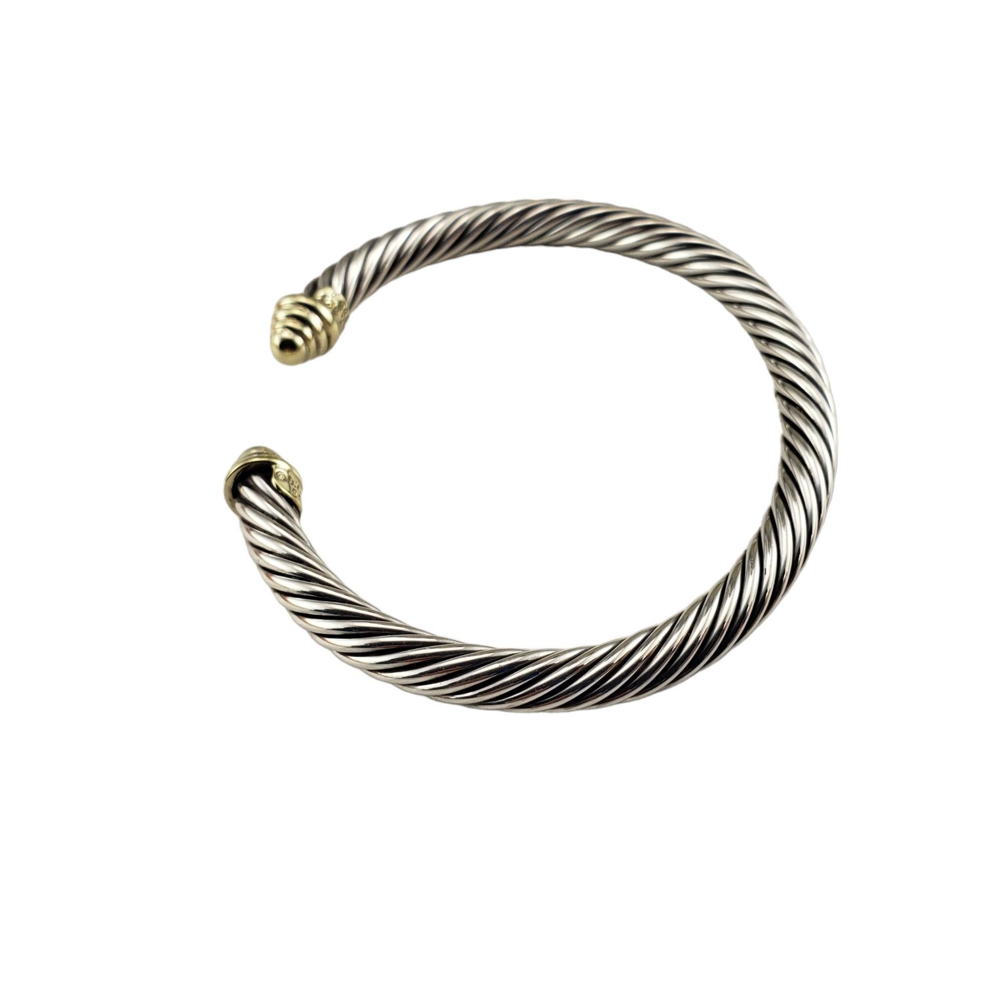 David Yurman Sterling Silver and 14K Yellow Gold Cable Cuff Bracelet-

This elegant cable bracelet by David Yurman is crafted in beautifully detailed sterling silver and 14K yellow gold.  Width:  5 mm.

Size: 6 inches (gap: 1 inch)

Hallmark:  David