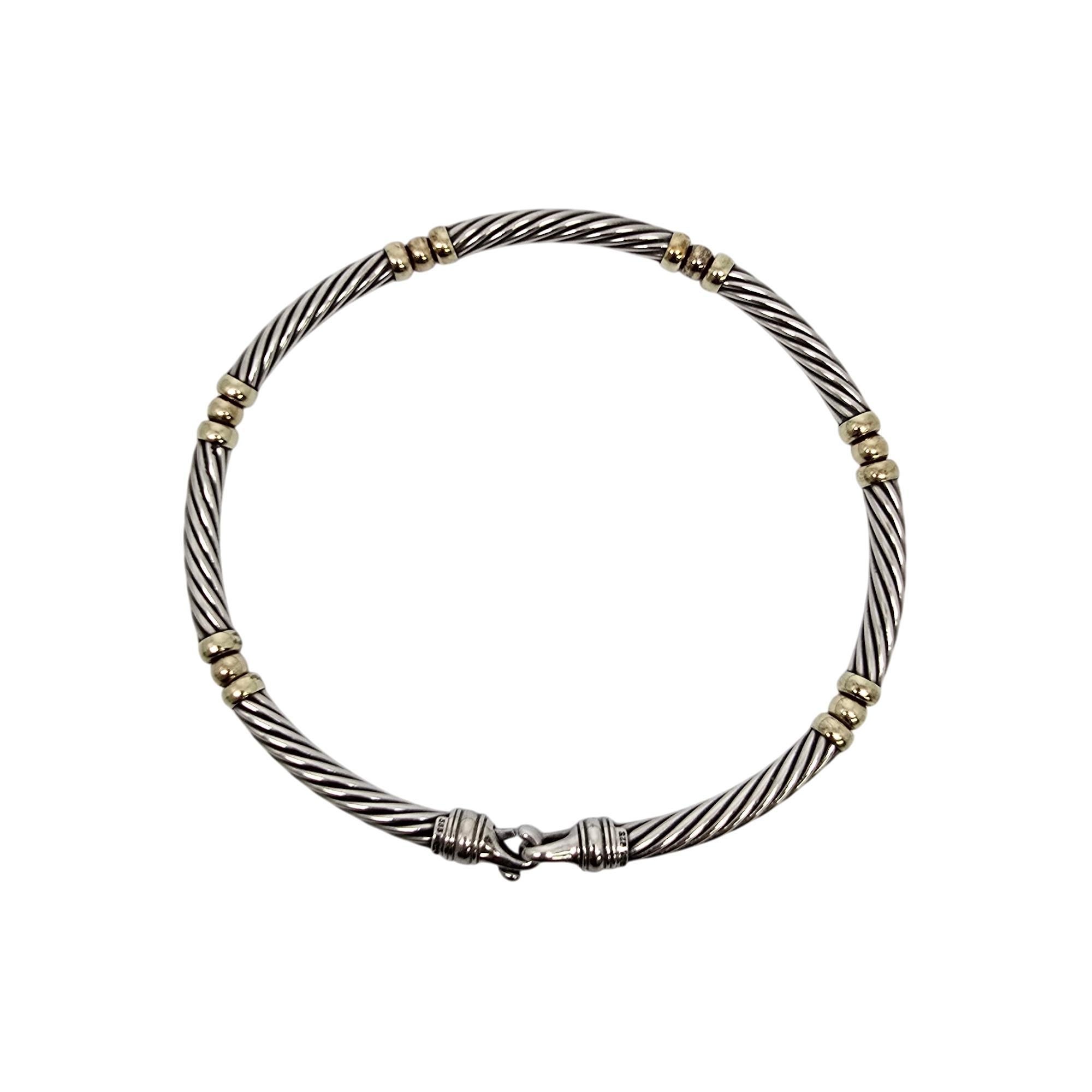 Sterling silver 14K yellow gold accent Hampton Cable Choker Necklace by David Yurman.

This necklace features David Yurman's iconic cable design with yellow gold accent end caps on each link with yellow gold swiveling ball joints between each link.