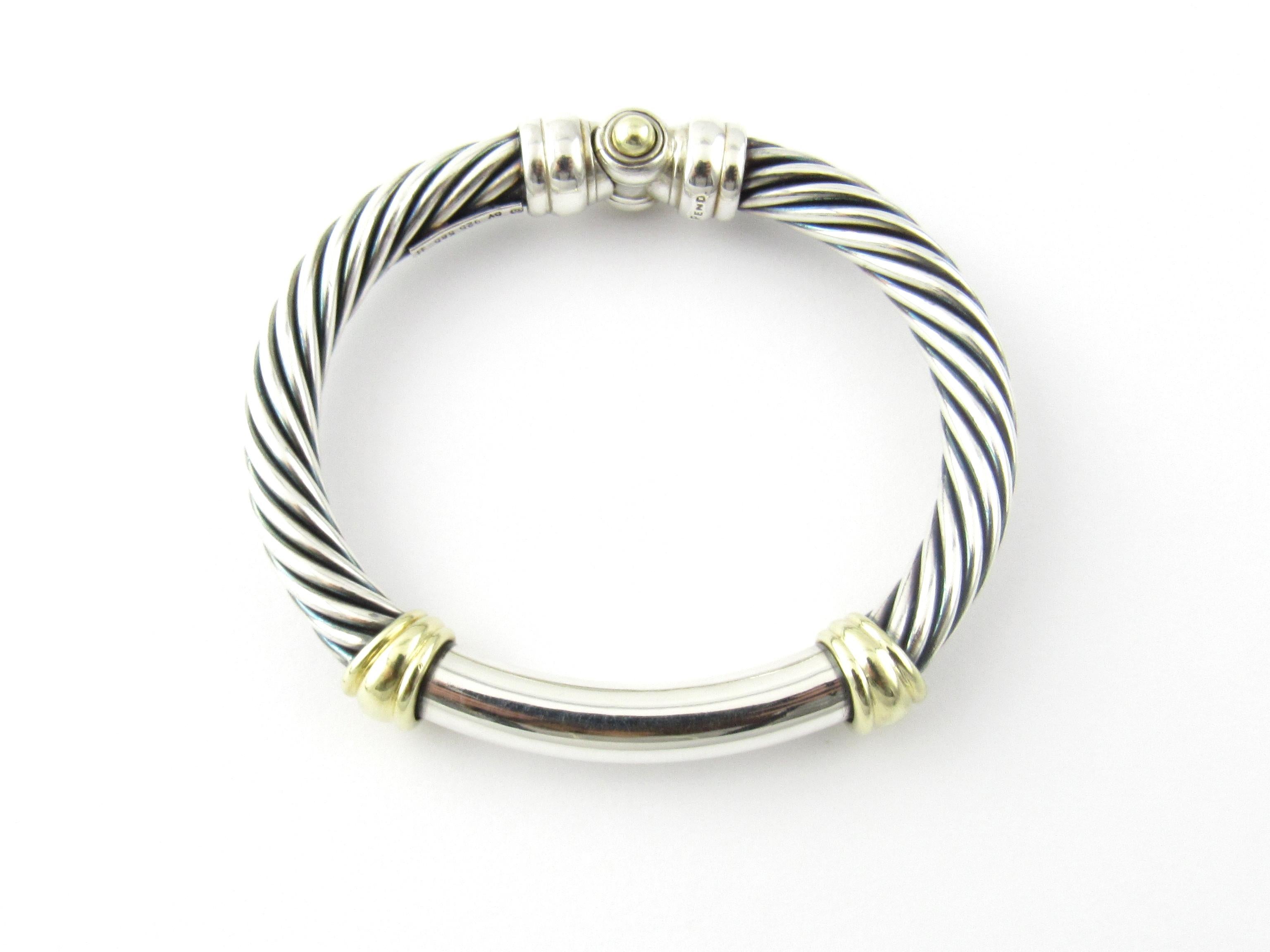 David Yurman Sterling Silver 14K Yellow Gold Hinged Bangle Bracelet

This authentic David Yurman bangle bracelet is approx. 7mm thick.

Measures approx. 6.5