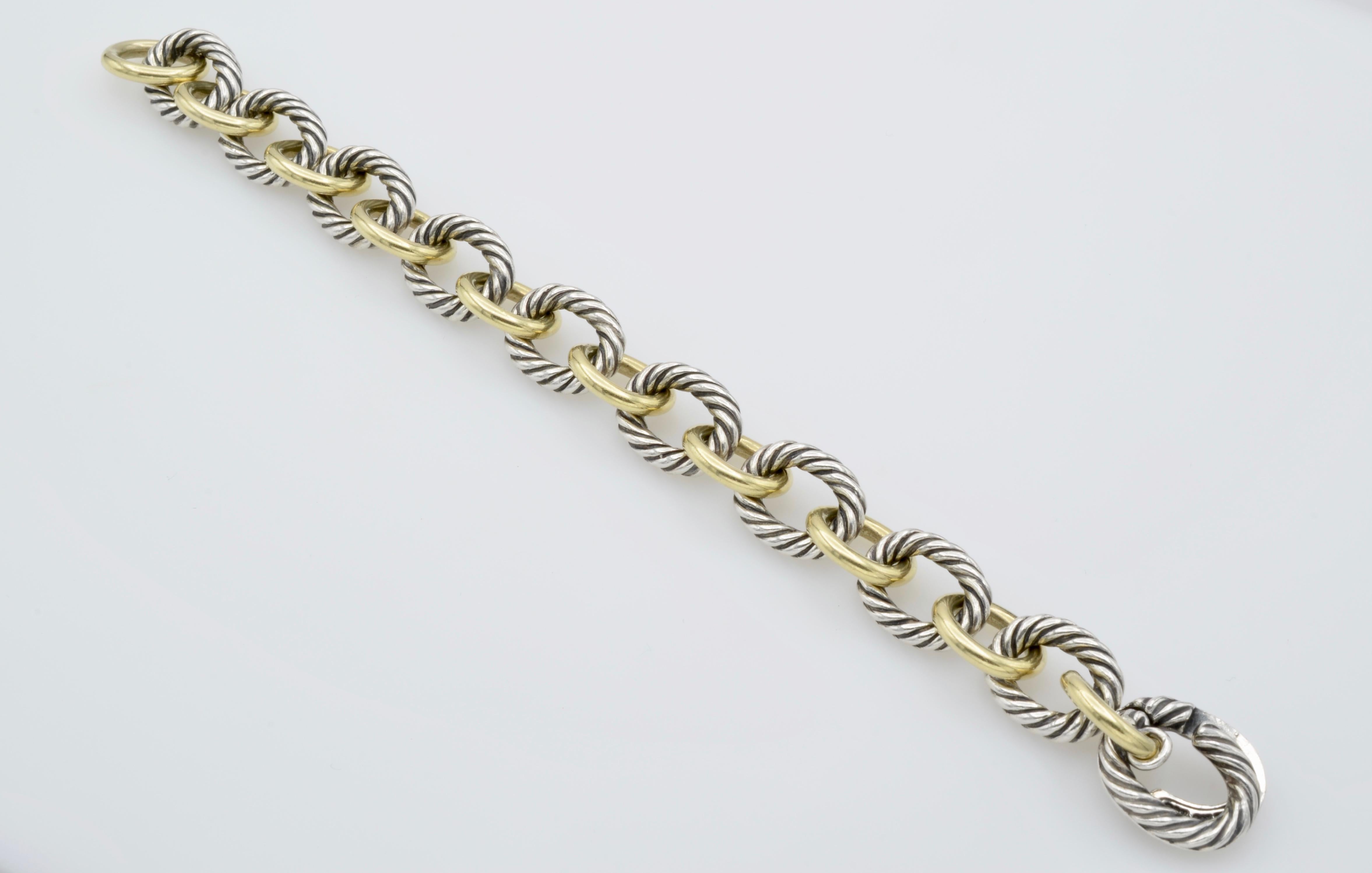 This classic link bracelet is a wonderful mixture of solid 18k gold links and twisted sterling silver links. It can be worn layered with your other bracelets and your watch as well as a stand alone 'statement' bracelet. The clasp is unique and