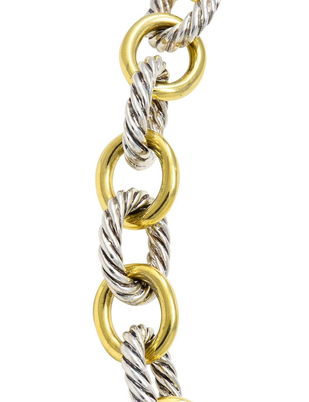 Link style necklace designed as silver twisted cable links with alternating polished gold links

Completed by a hinged concealed clasp

Signed DY for David Yurman

Stamped 925 and 750 for sterling silver and 18 karat gold, respectively

Length: 15