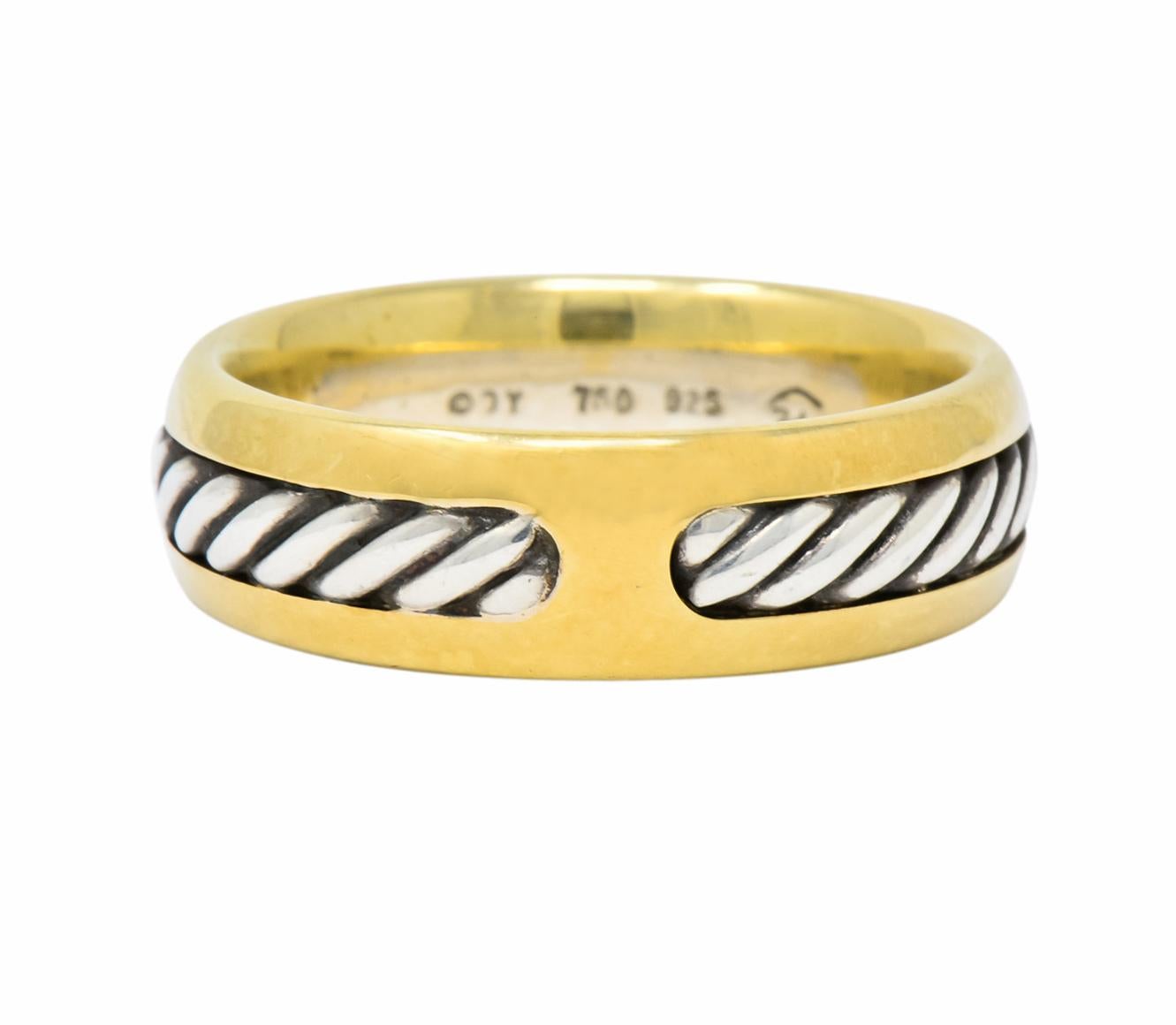 Band style ring centering a sterling silver twisted cable motif recessed in channel

Surrounded by high polished gold

Signed DY for David Yurman

Stamped 925 and 750 for sterling silver and 18 karat gold

Ring Size: 10 1/4 & not sizable

Top