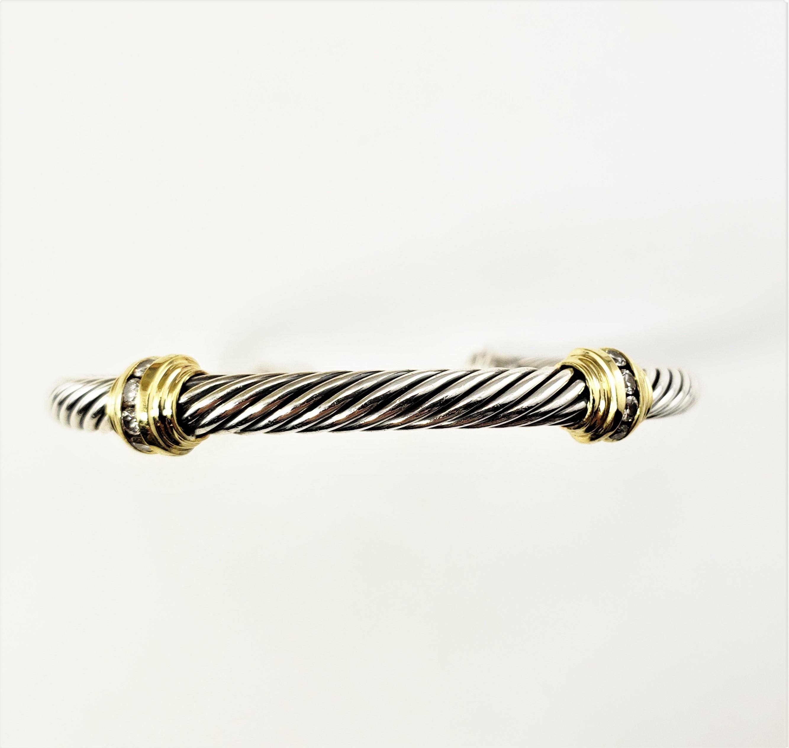 David Yurman Sterling Silver/18 Karat Yellow Gold and Diamond Cable Cuff Bracelet-

This lovely David Yurman cuff bracelet features eight round brilliant cut diamonds set in classic sterling silver and 18K yellow gold.  Width:  5 mm.

Approximate