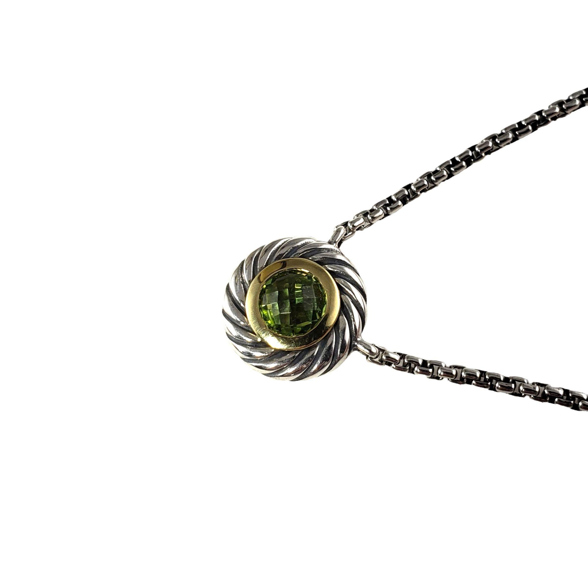Vintage David Yurman Sterling Silver/18 Karat Yellow Gold and Peridot Cookie Necklace-

This lovely David Yurman pendant necklace features one faceted peridot (5 mm) set in beautifully detailed sterling silver and 18K yellow gold.

Size: 16.5 inches