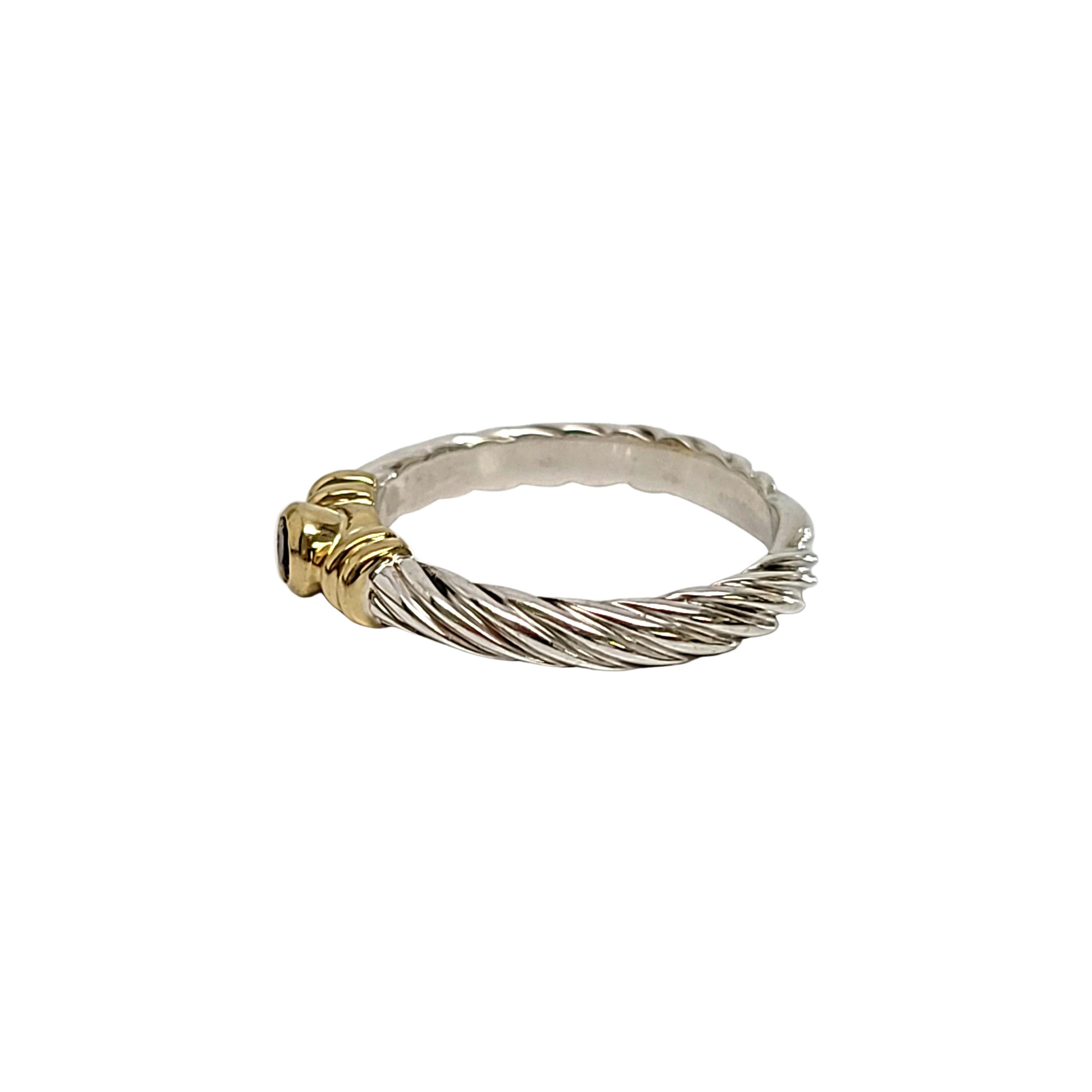 Sterling silver and 18K yellow gold amethyst pinky ring by David Yurman.

Size 4

Features a small round faceted amethyst surrounded by an 18K yellow gold bezel and twisted cable design band.

Measures 2.5mm wide band. Stone measures approx 2.5mm in