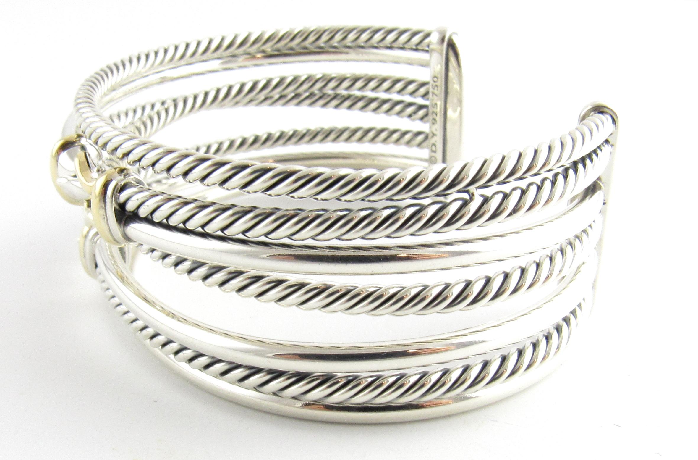 David Yurman Sterling Silver 18K Yellow Gold Buckle Crossover Cuff Bracelet 

This authentic David Yurman cuff bracelet was a gift and only worn once.

Size M

22mm wide

Comes with Box, folder, cleaning cloth, pouch and invoice from
