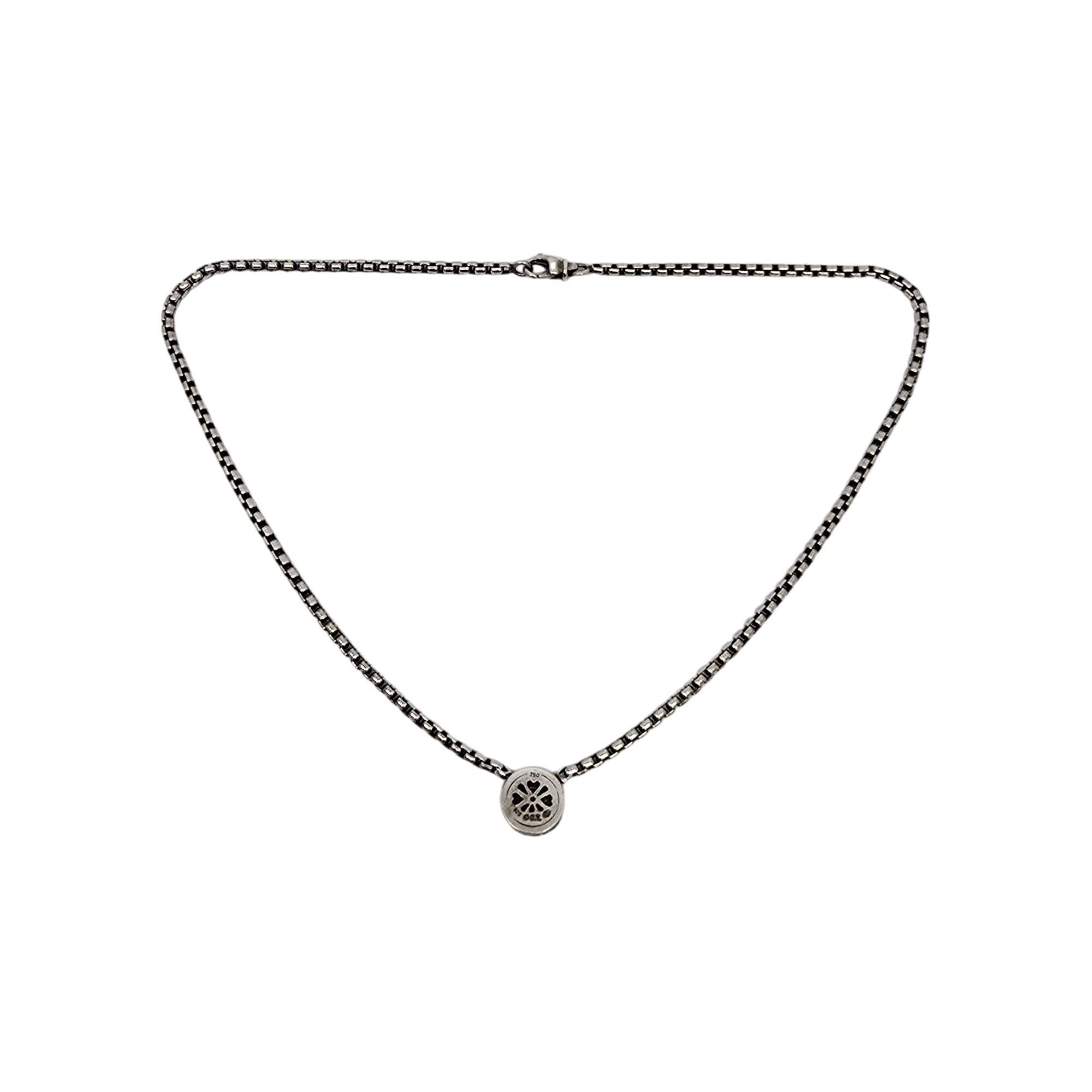 Sterling silver 18K yellow gold accent Cookie Necklace by David Yurman.

This necklace features a round box chain with a small round pendant with a cluster of small diamonds in a gold bezel surrounded by David Yurman's iconic cable design. Lobster