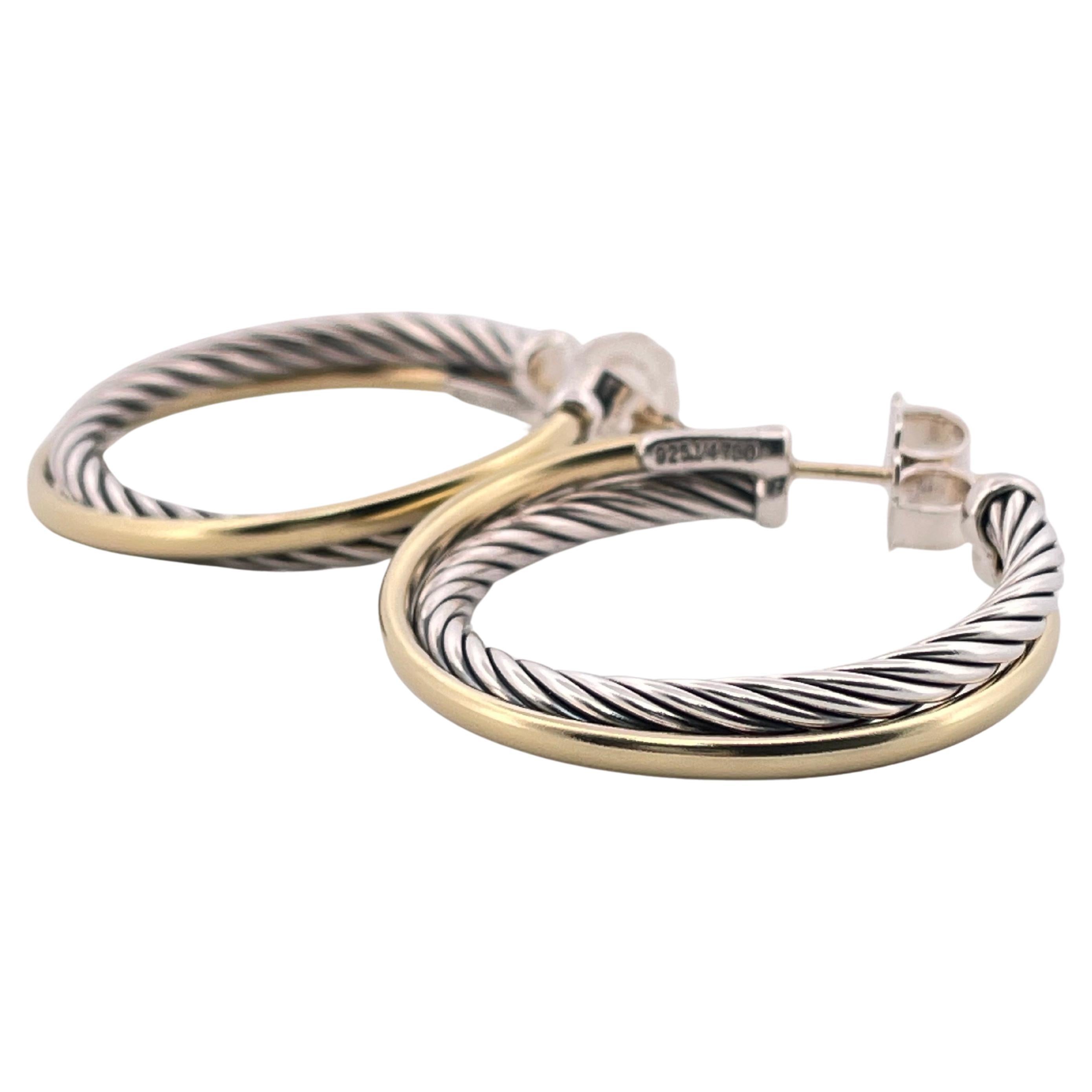 These exquisite David Yurman hoop earrings showcase the brand’s signature artistry, combining timeless elegance with contemporary design. Crafted from a luxurious blend of 18k yellow gold (marked 750) and sterling silver (marked 925), they weigh a