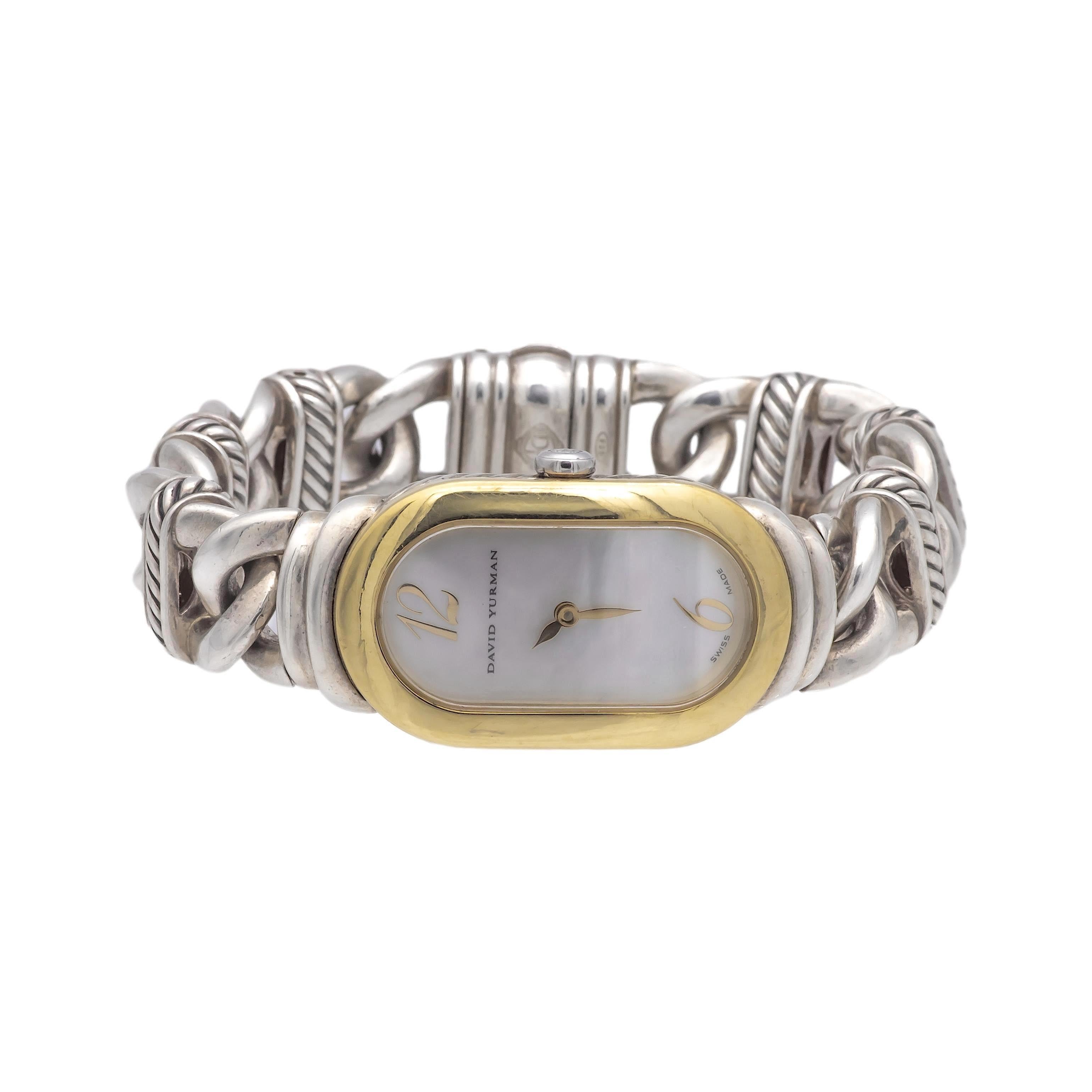 David Yurman ladies watch bracelet from the Madison collection finely crafted in sterling silver with an oval shape mother of pearl face with an 18K yellow gold markers and bezel frame. The watch has a cable link bracelet measuring 6.75 inches long