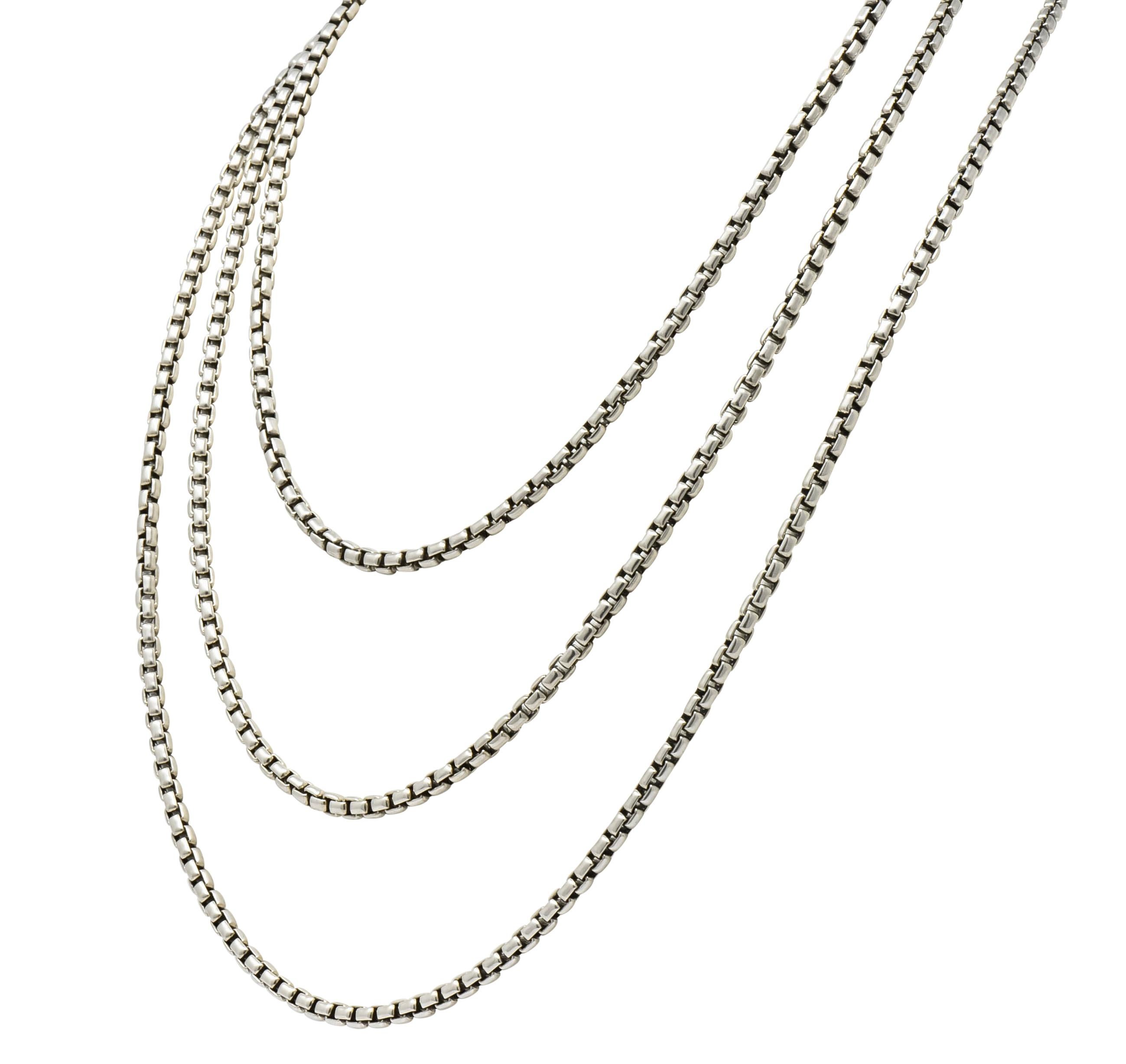 Box style long chain necklace comprised of polished rectangular silver links

Accented by a 14 karat gold logo link, pierced DY for David Yurman

Completed by lobster clasp

With maker's mark and logo link is stamped 585 and 925 for 14 karat gold