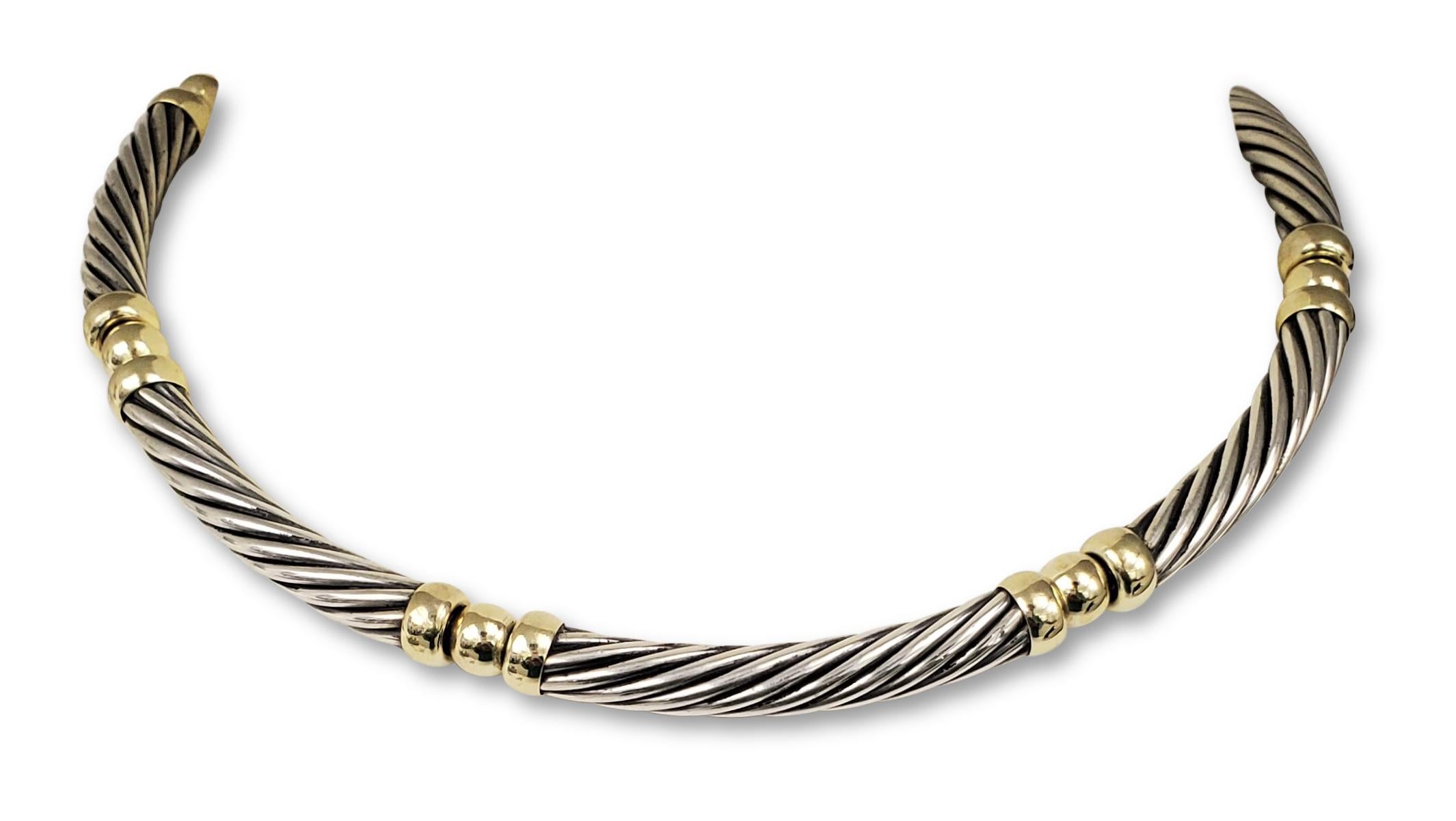 Authentic David Yurman 6mm cable necklace crafted in Sterling Silver and 14 karat yellow gold.  Features Yurman's classic cable design in 7 links.  5 1/2 inch diameter.  Signed DY, 925, 585.  CIRCA 1990s