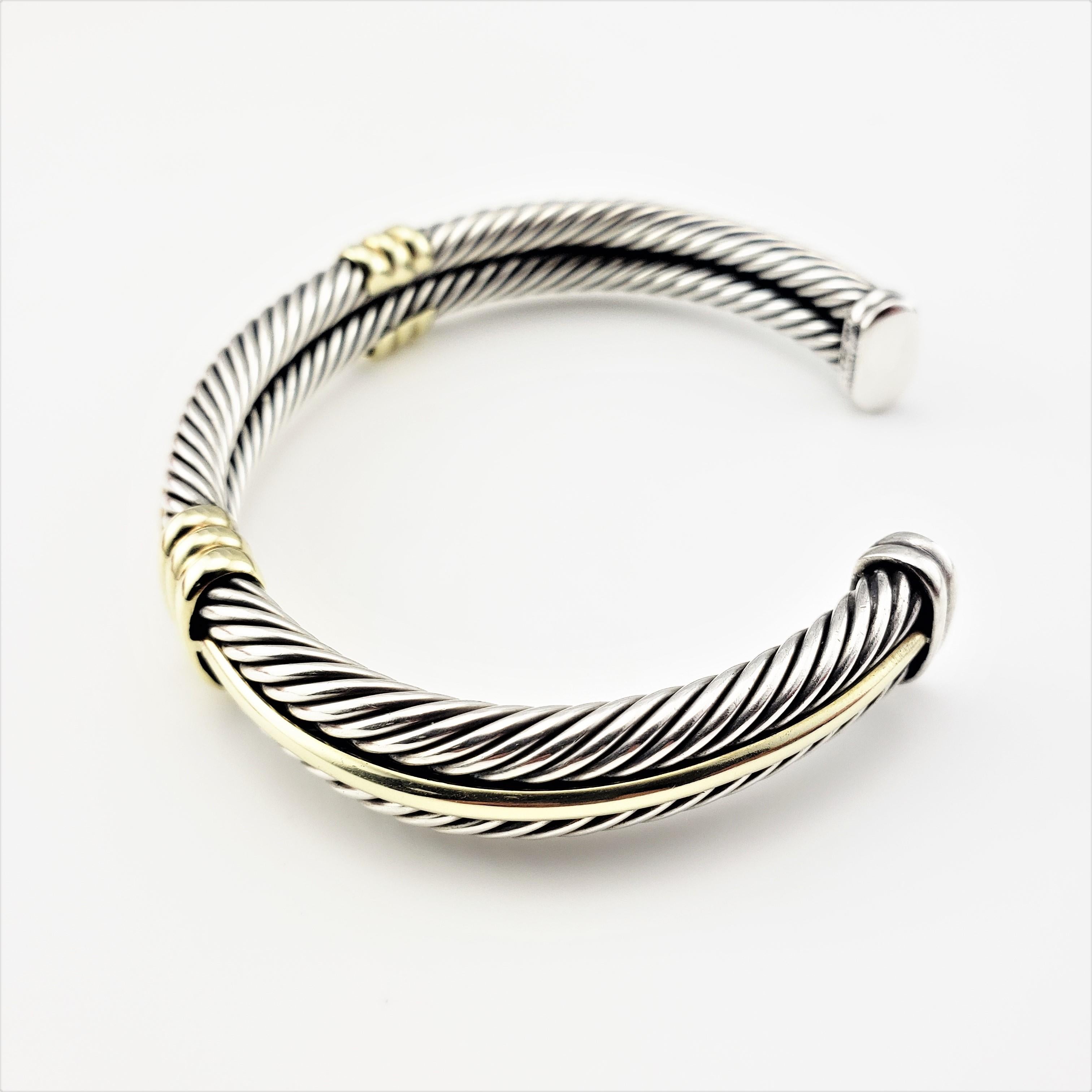 David Yurman Sterling Silver and 14 Karat Yellow Gold Cable Cuff Bracelet-

This elegant cuff bracelet by David Yurman is crafted in beautifully detailed 14K yellow gold and sterling silver.

This bracelet is 8
